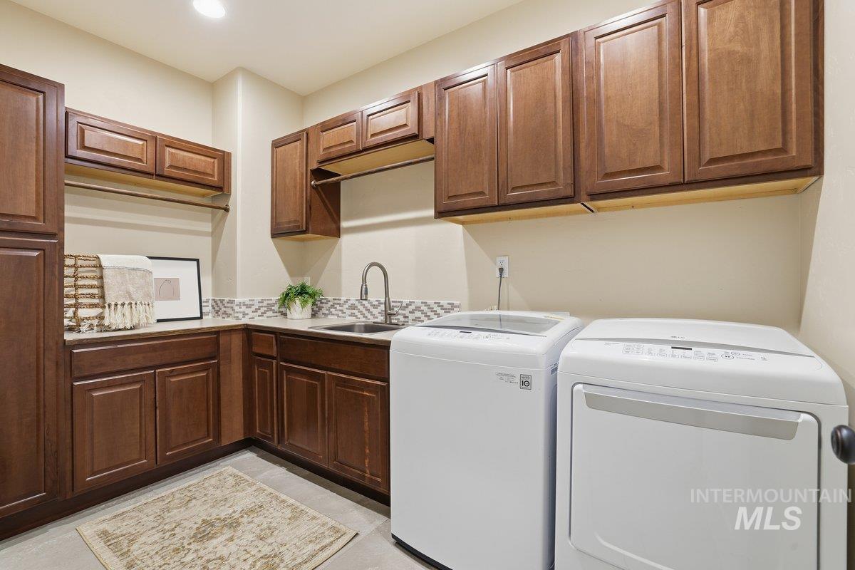 Laundry room with washer and dryer and cabinet space