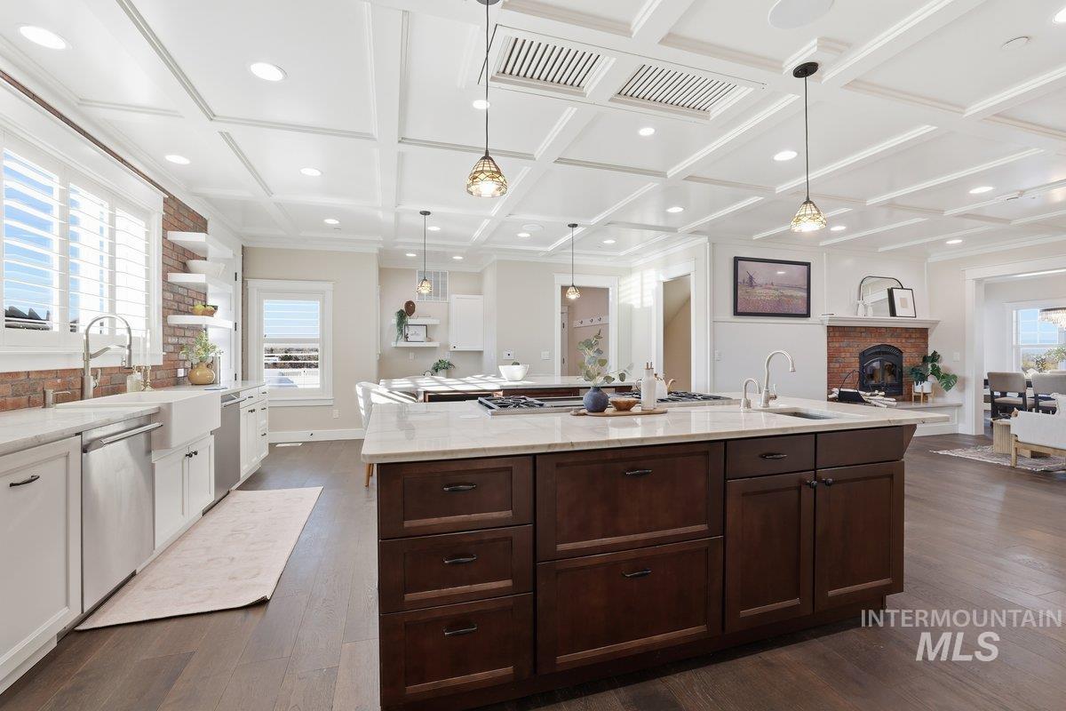 Kitchen with white cabinets, open shelves, high end appliances, pendant lighting,beam ceiling, Frigidaire side by side fridge & freezer, Thermador Bakers Oven with additional steam oven, Gas stove top, 2 dishwashers