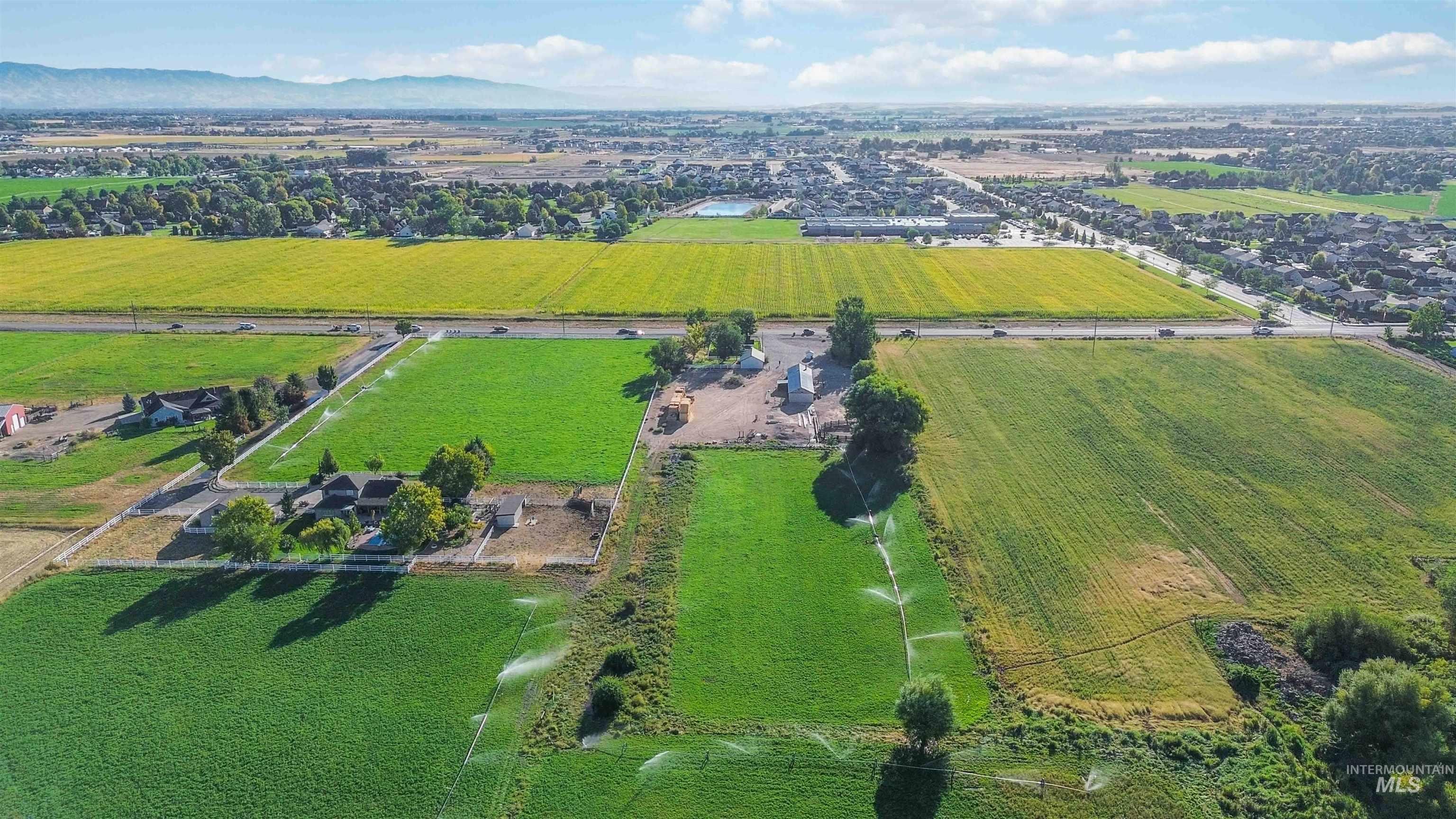 View of property location with a mountain backdrop and rural landscape