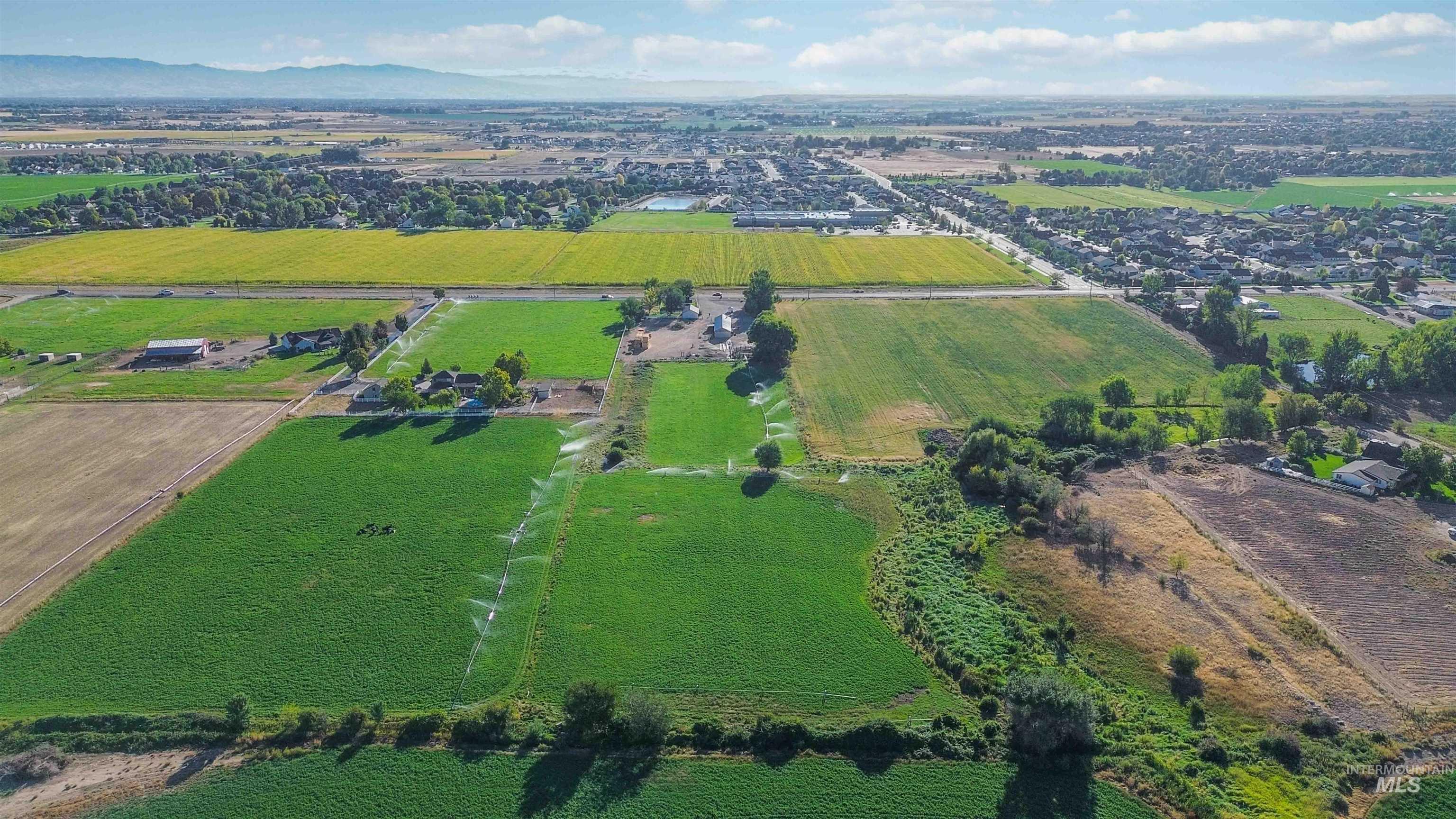 Aerial view of property and surrounding area with rural landscape