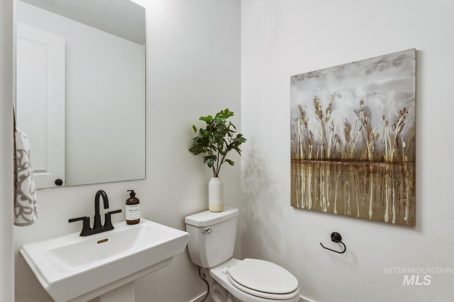 Bathroom featuring toilet and a sink
