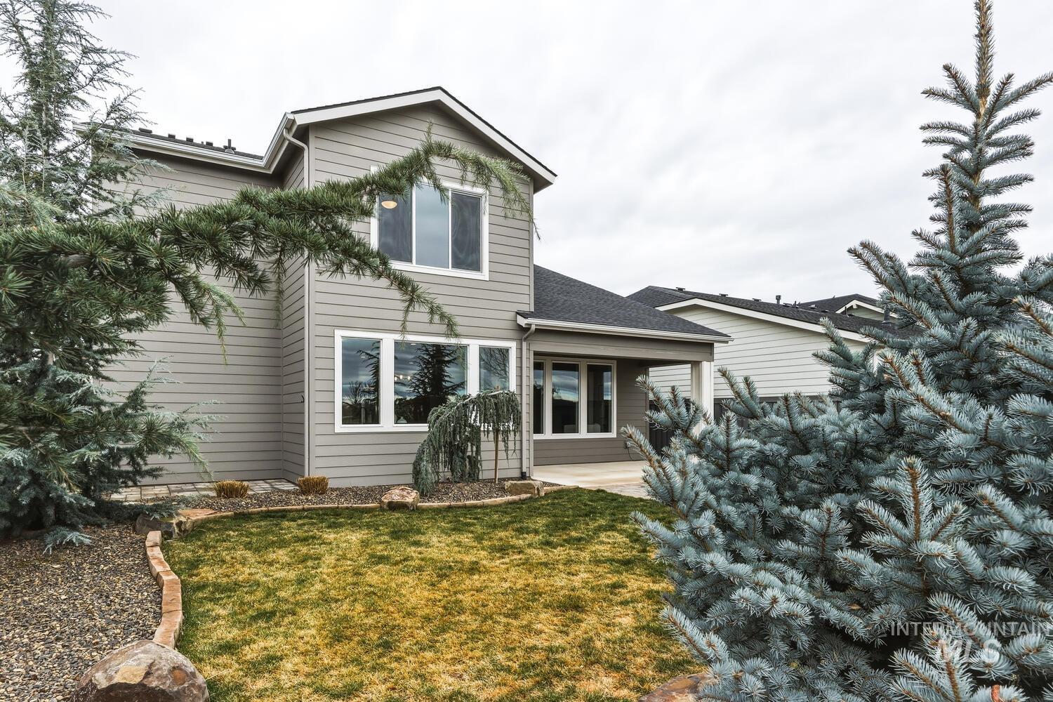 Rear view of property featuring a yard