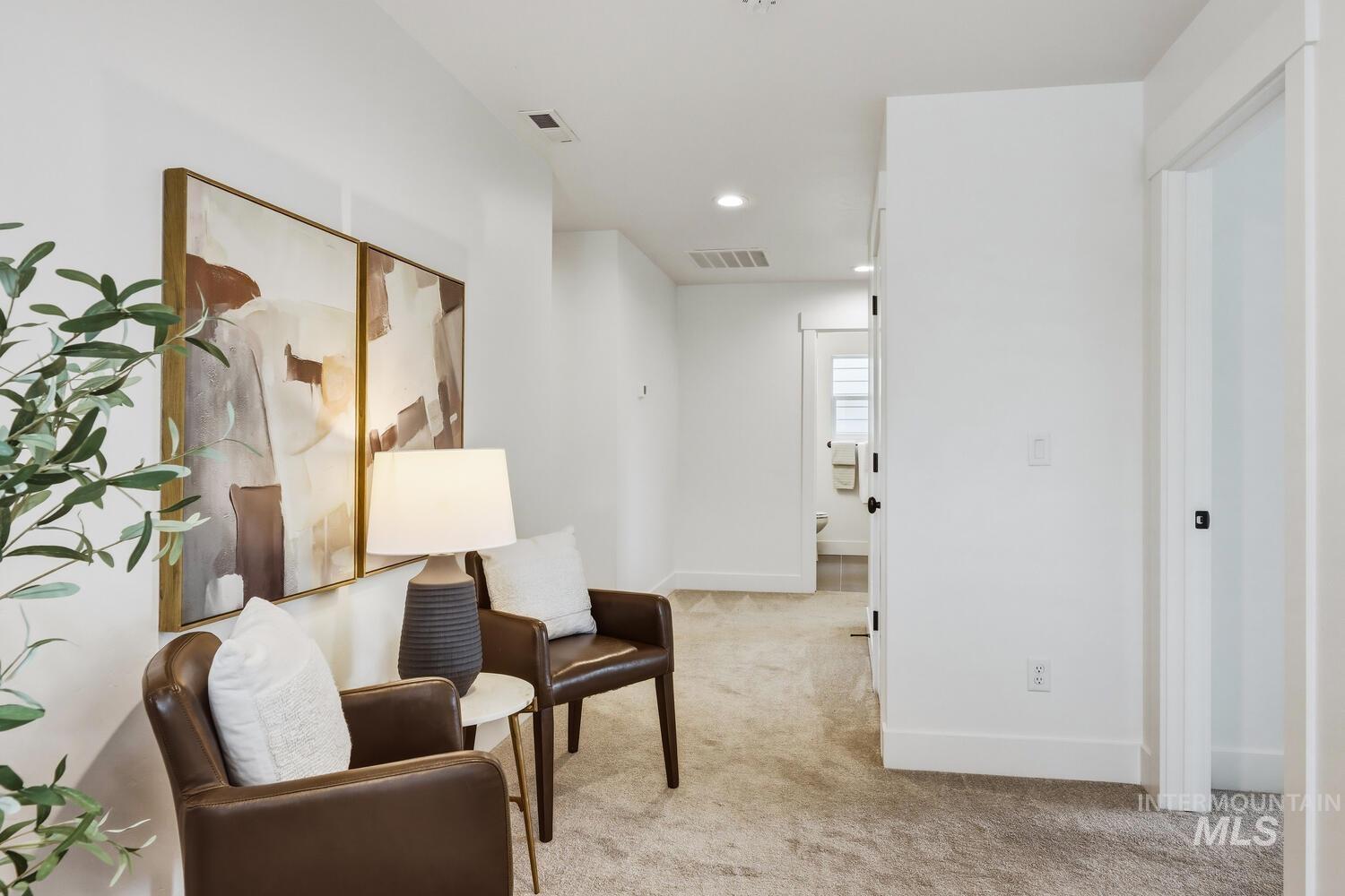 Sitting room featuring light carpet and recessed lighting