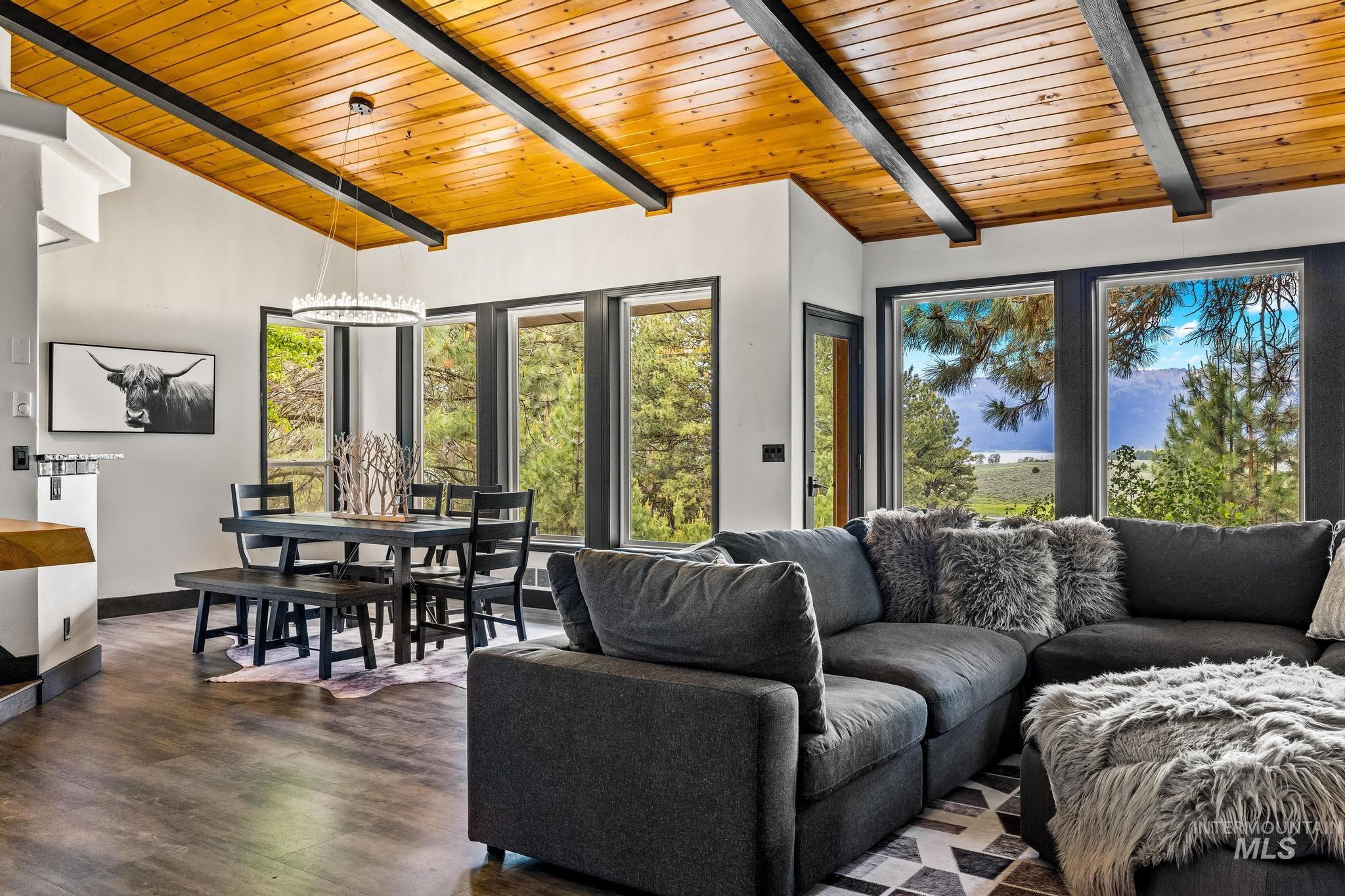 Living area featuring wooden ceiling and wood finished floors