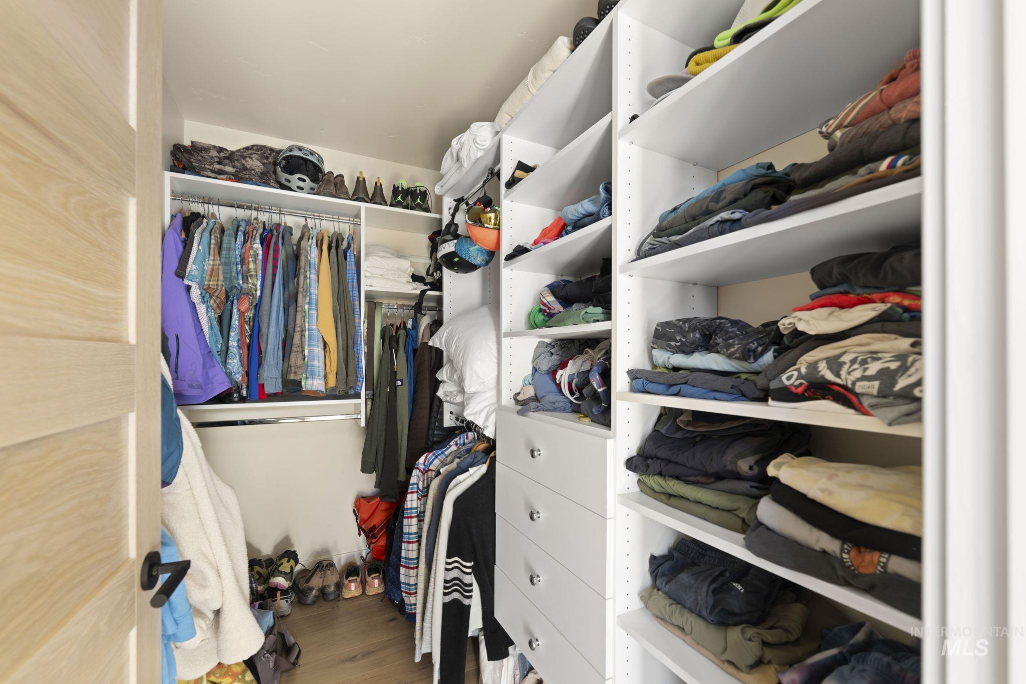 Spacious closet with wood finished floors
