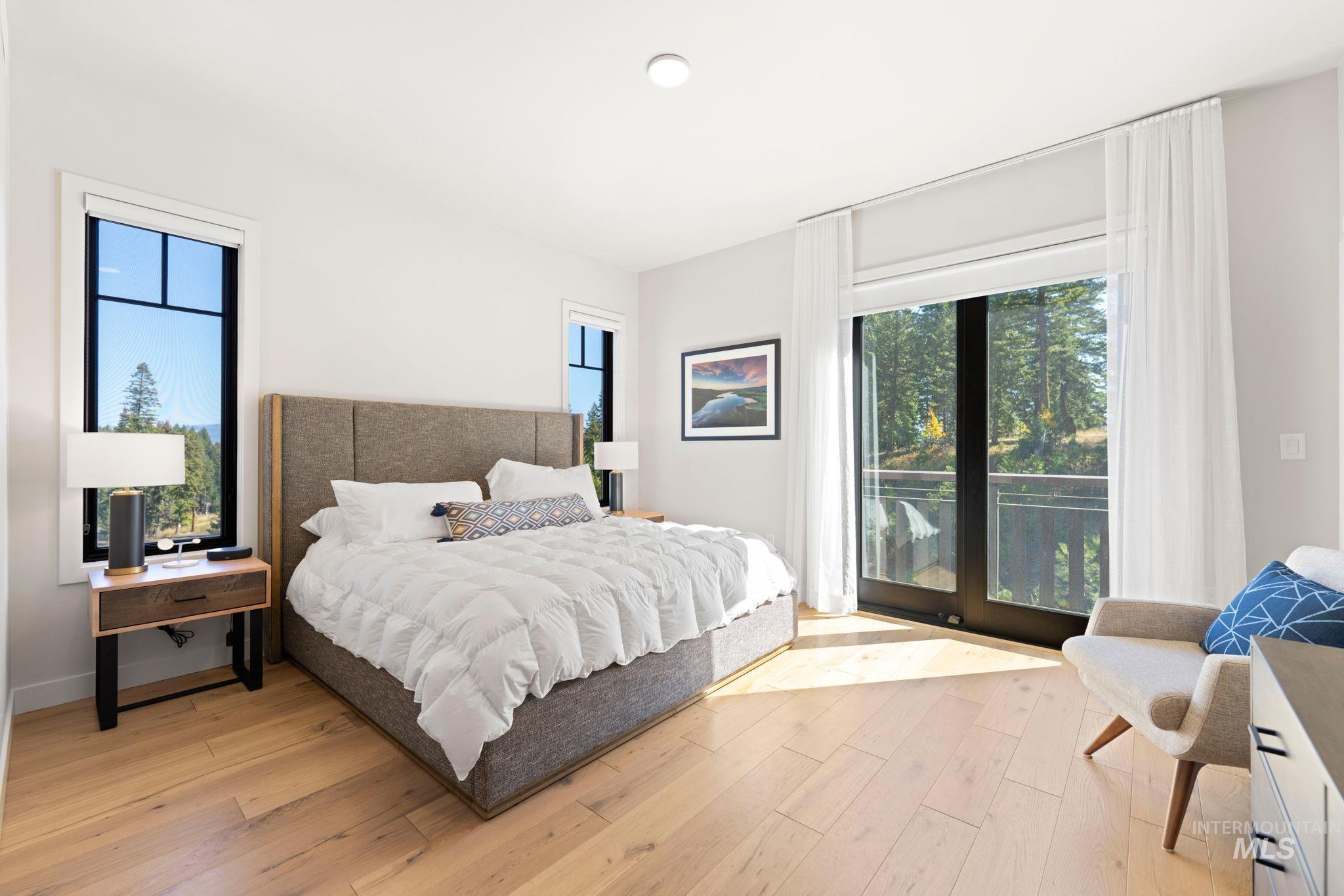 Bedroom featuring light wood-style flooring and access to outside