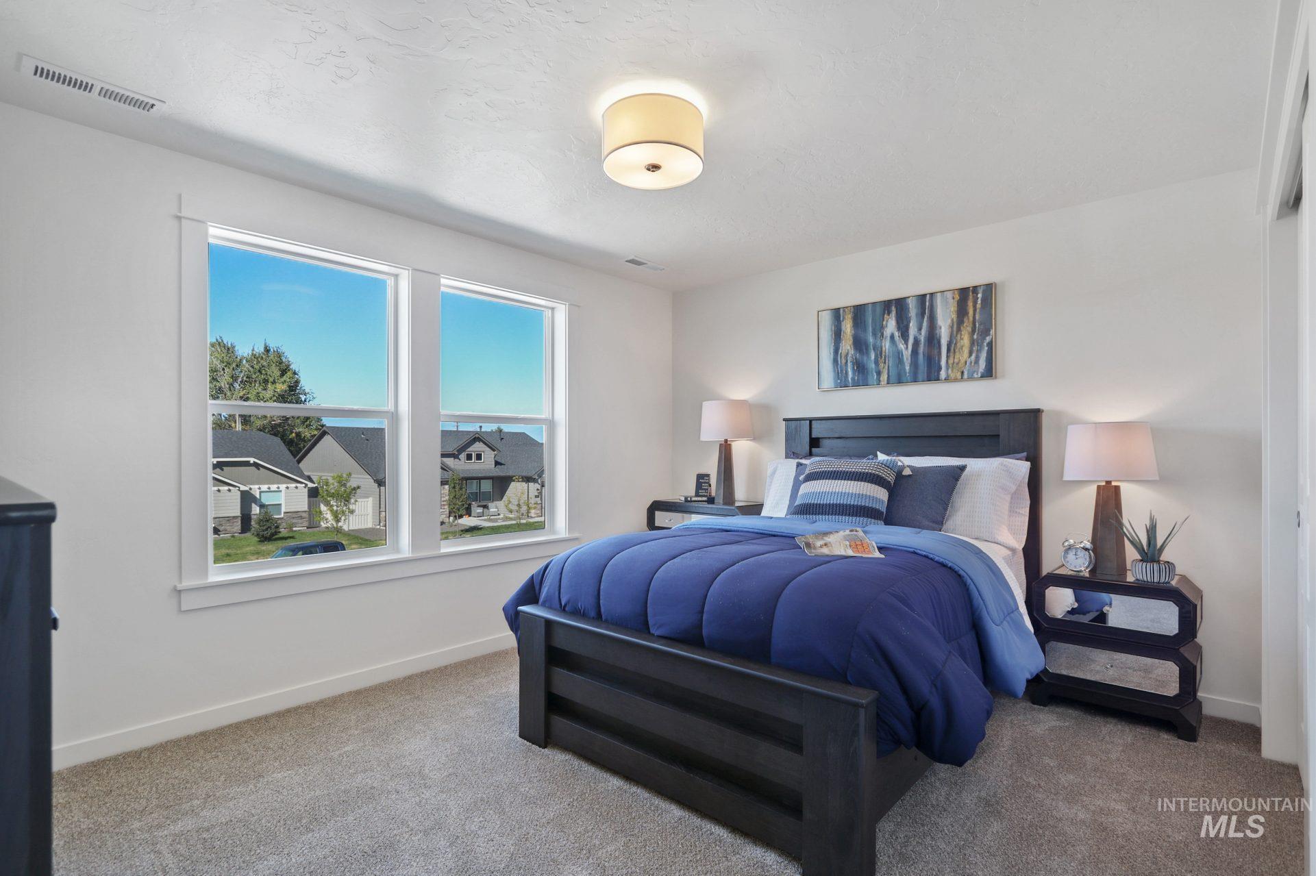 Carpeted bedroom with baseboards