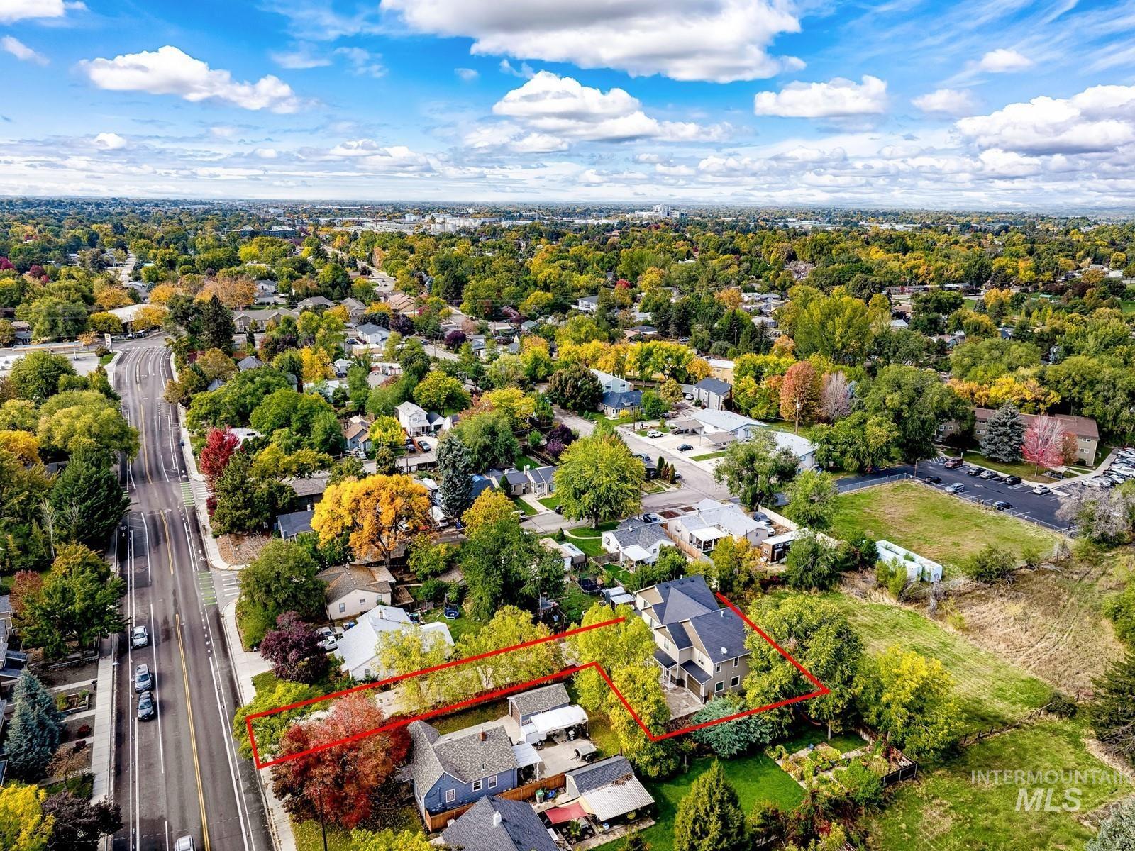 Aerial perspective of suburban area with property boundaries highlighted