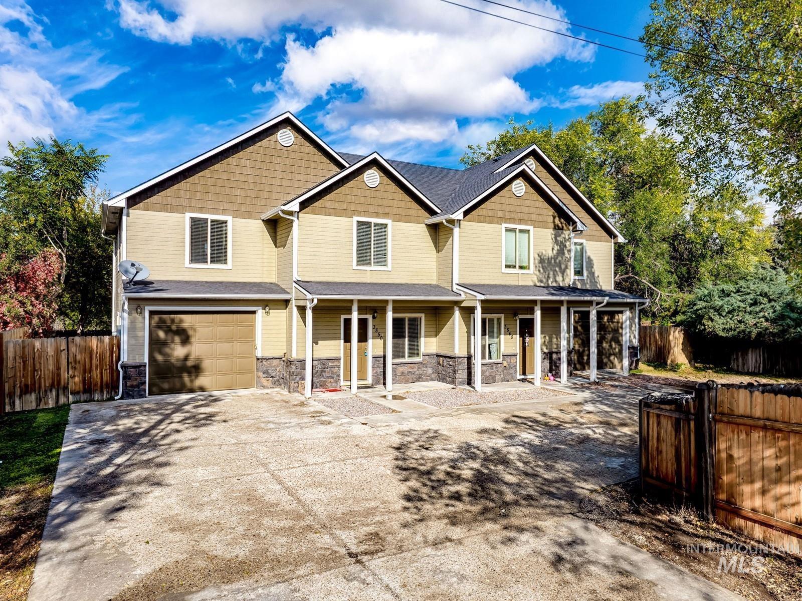 Craftsman house with a porch, stone siding, an attached garage, and concrete driveway