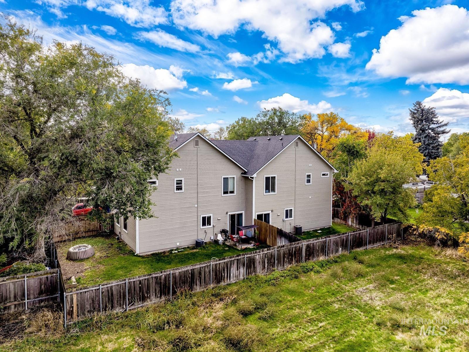 Back of property featuring a fenced backyard
