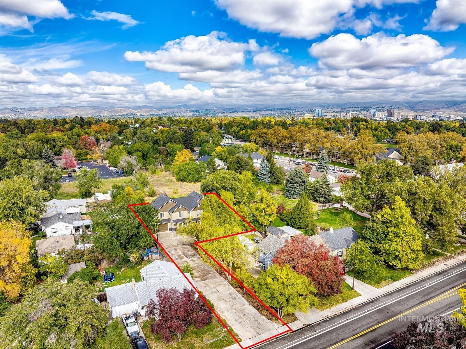 Aerial view of residential area with property parcel outlined