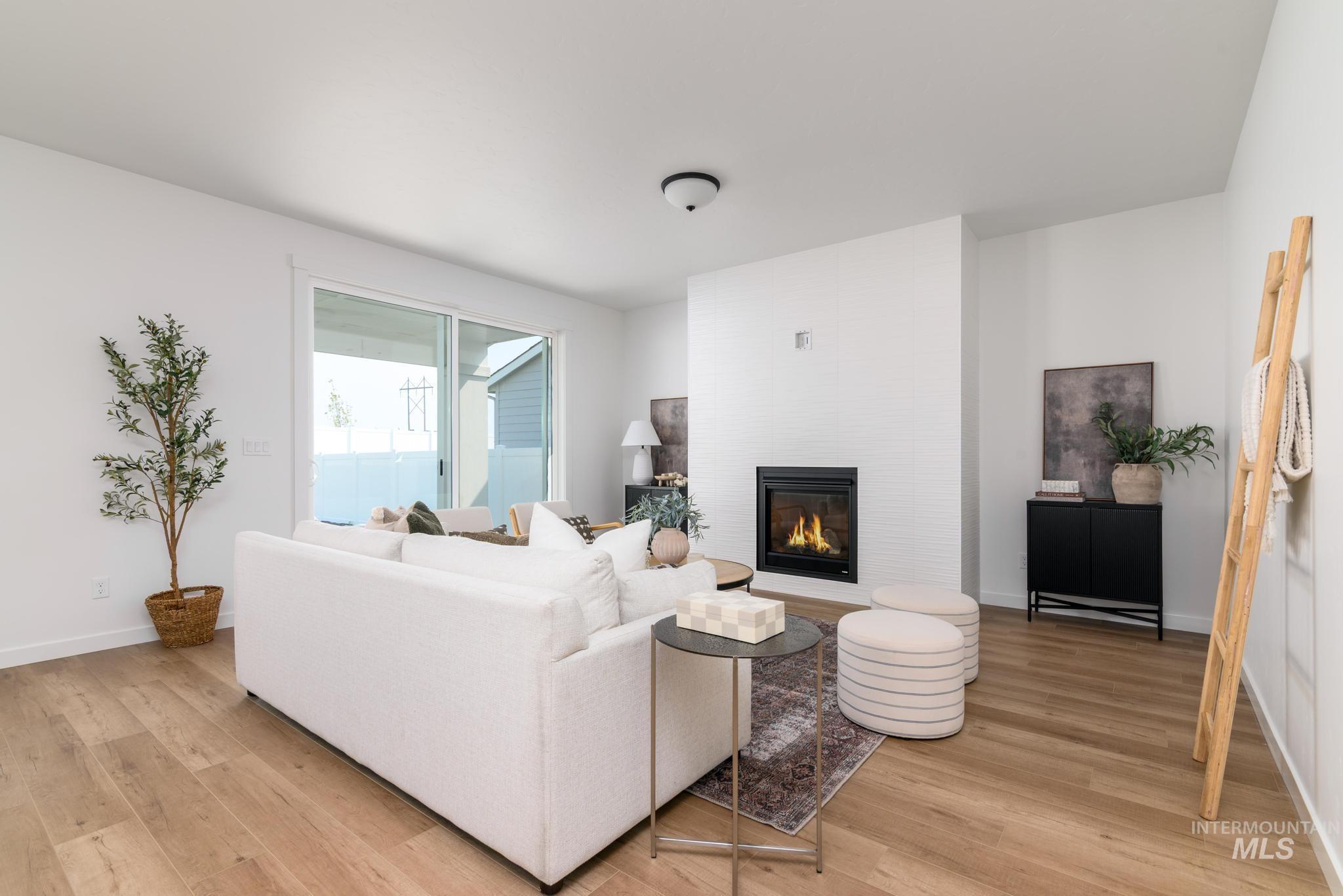 Living area featuring a fireplace and light wood finished floors