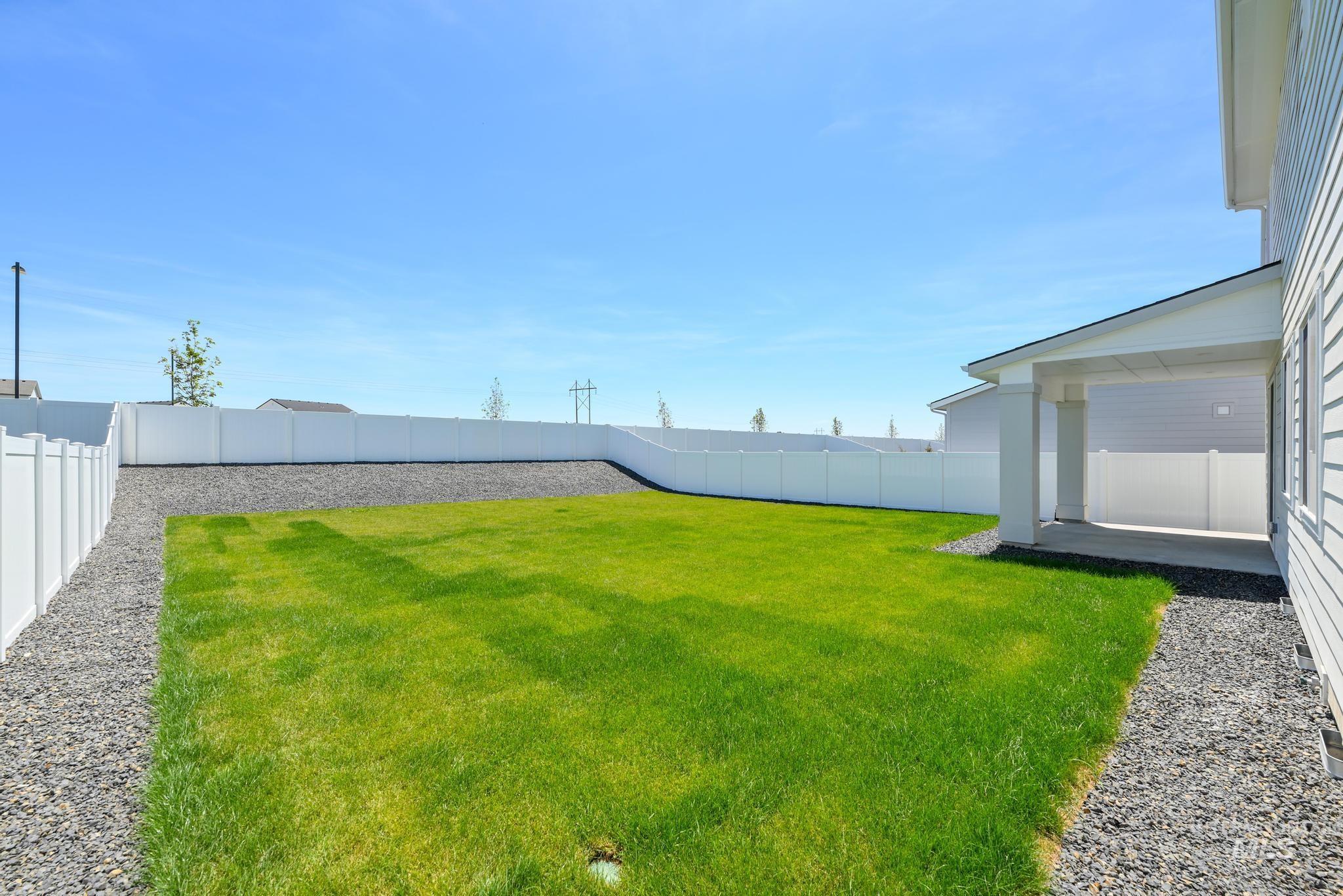 View of fenced backyard