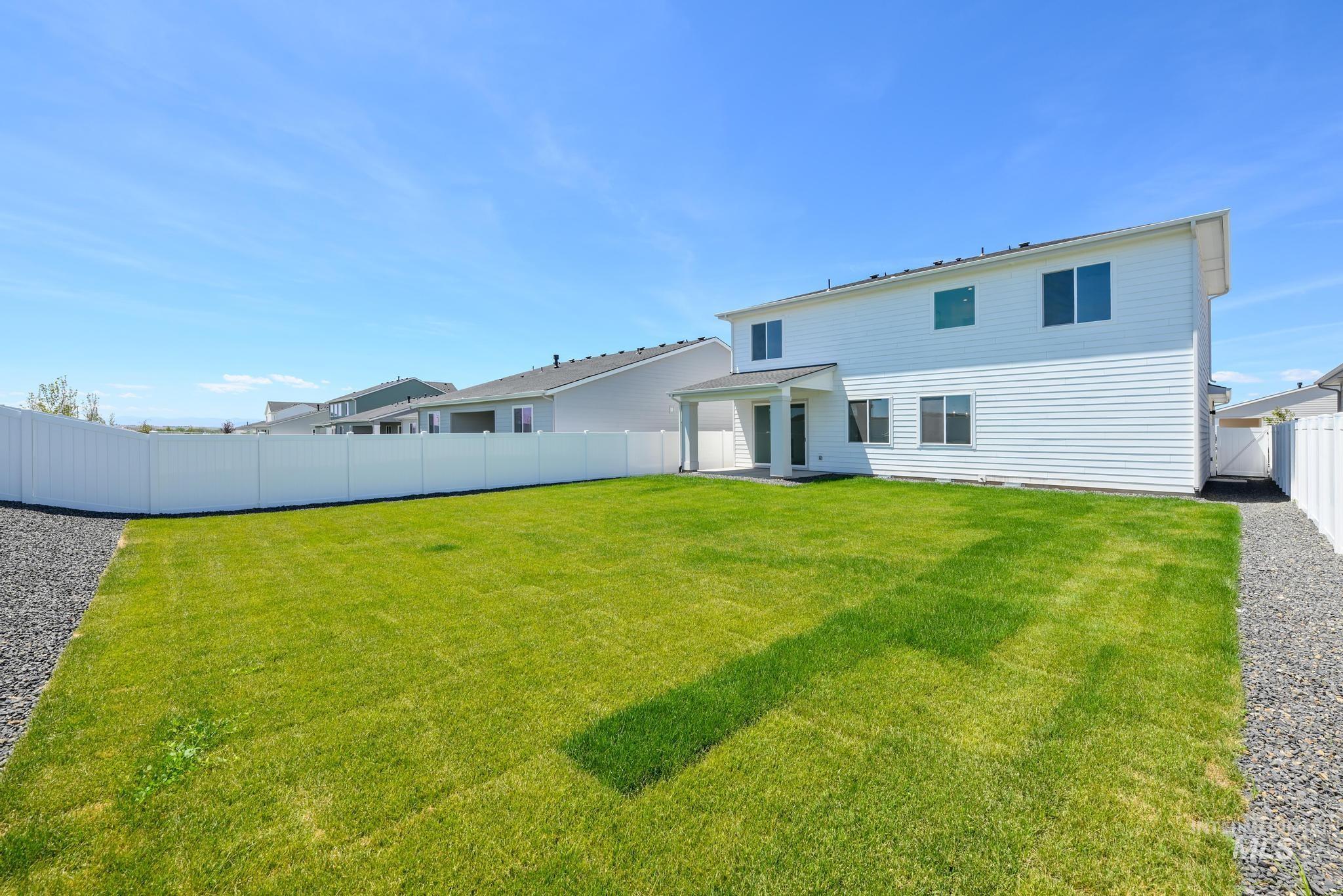 Back of house featuring a fenced backyard