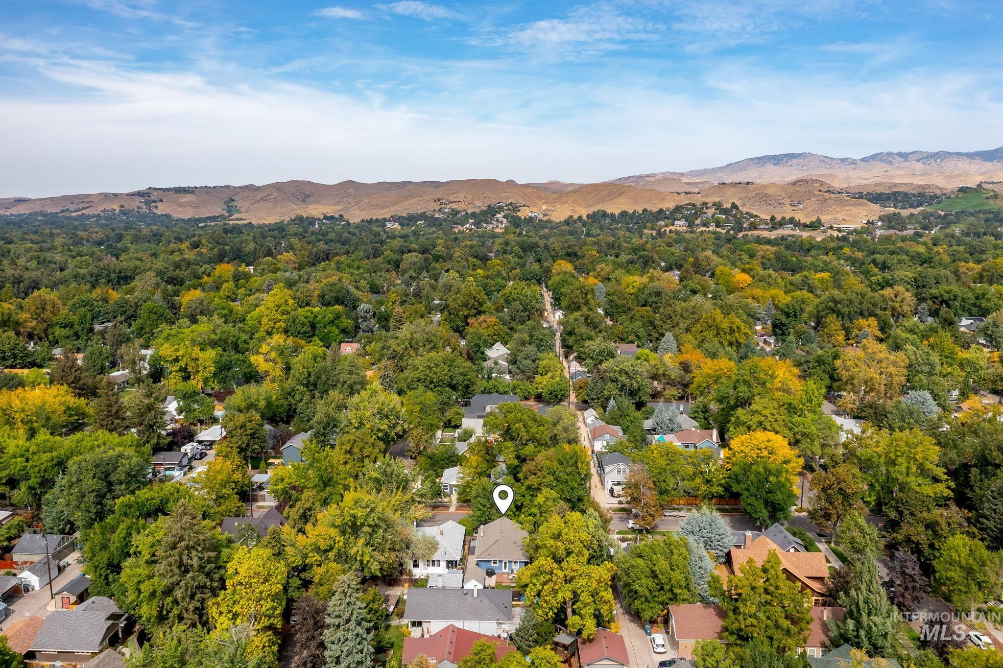 Aerial view of residential area with a mountainous background
