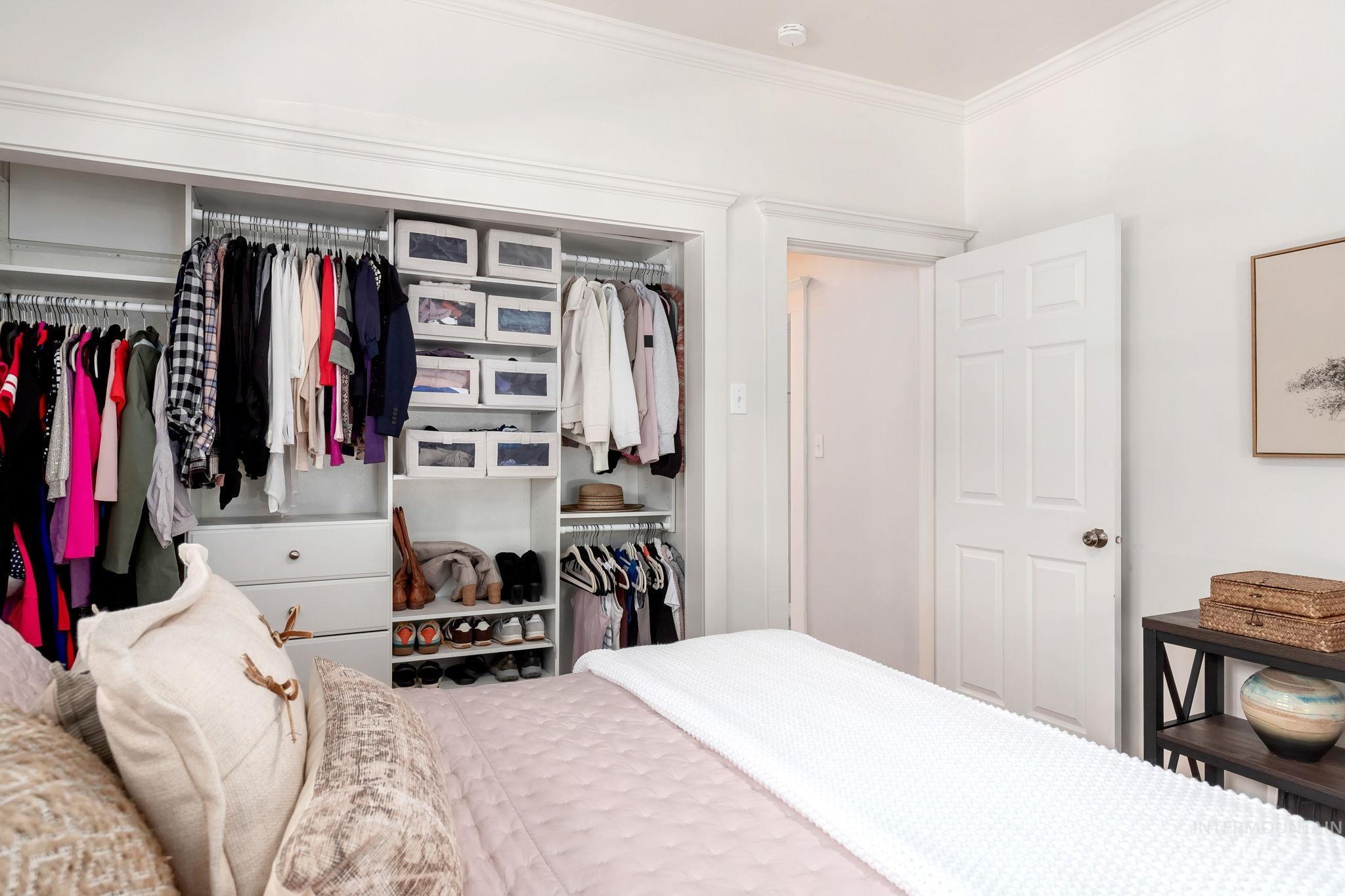 Bedroom featuring ornamental molding and a closet
