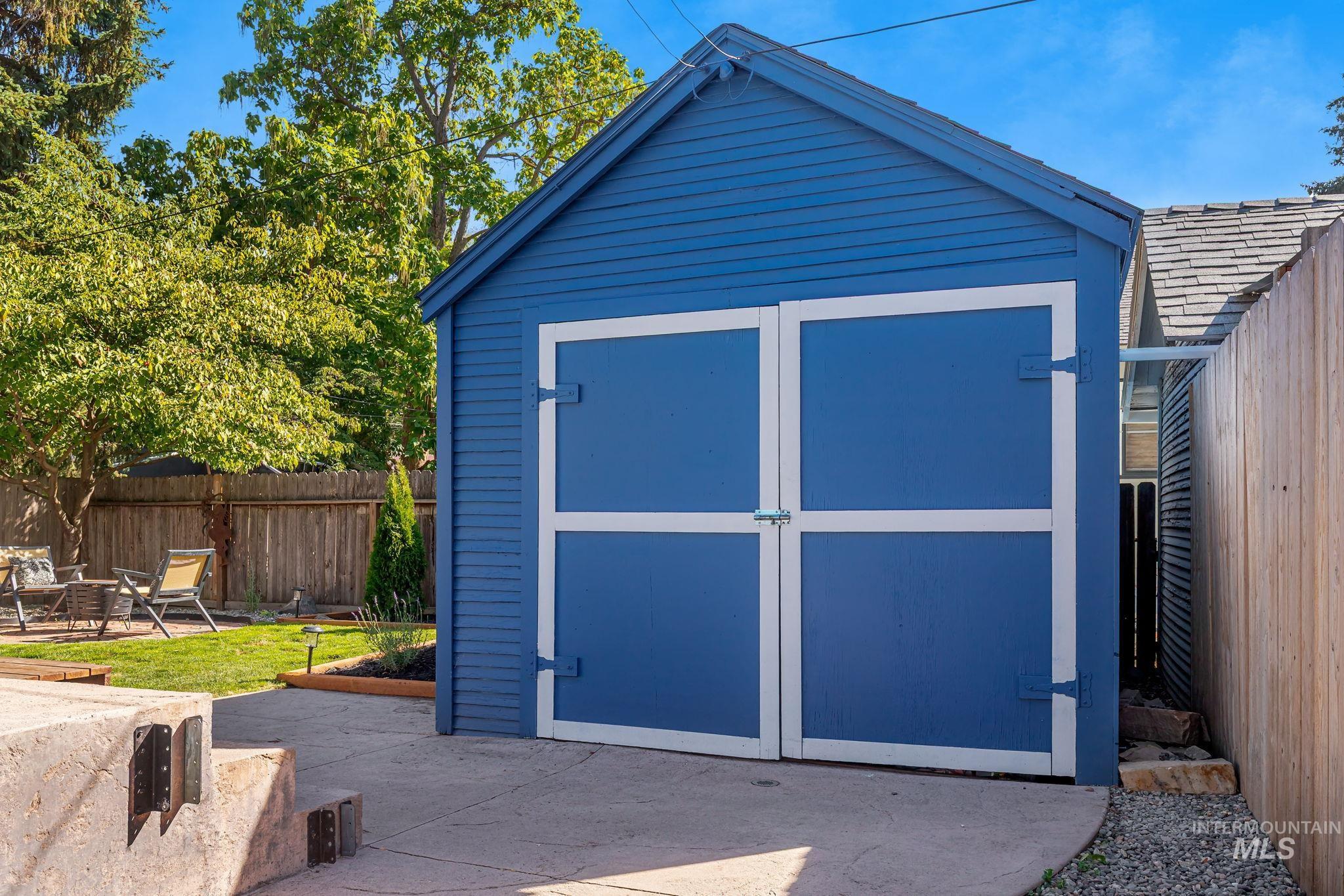 View of shed featuring a fenced backyard