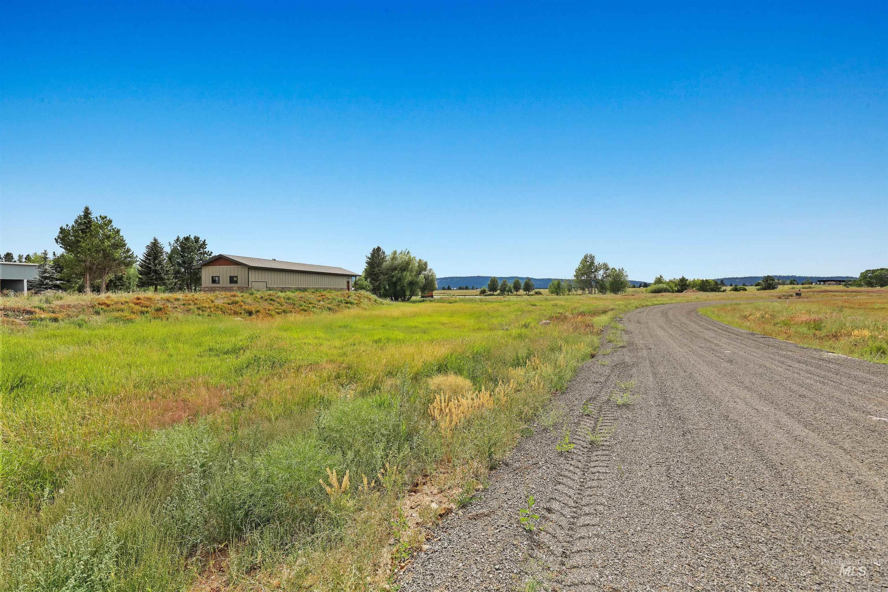 View of dirt / gravel road featuring a view of countryside