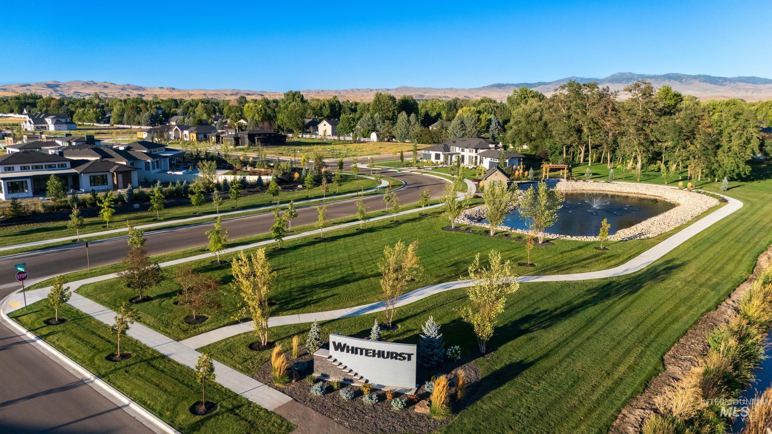 Aerial view of property's location with a water and mountain view