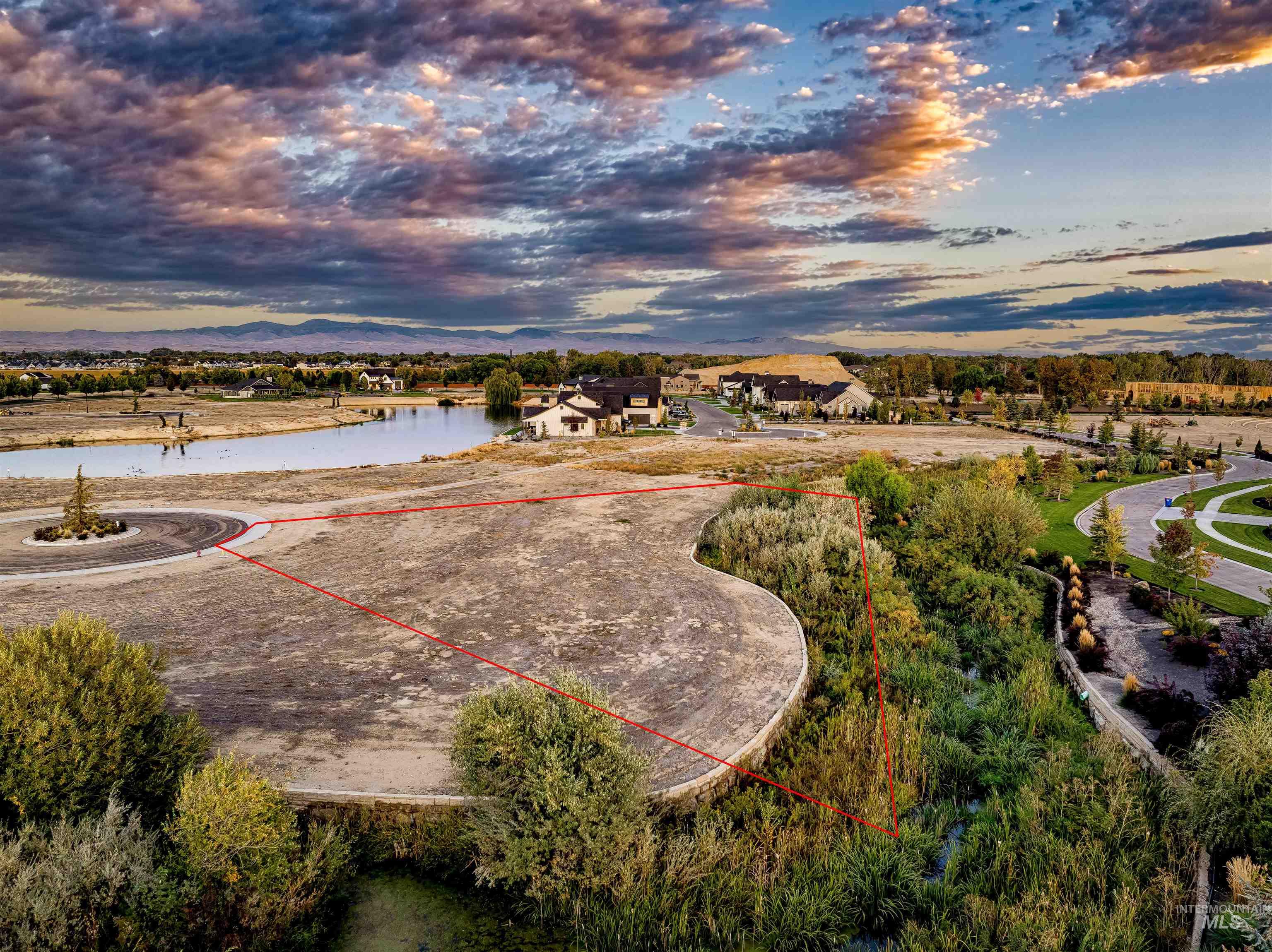 Aerial overview of property's location with a nearby body of water and property parcel outlined