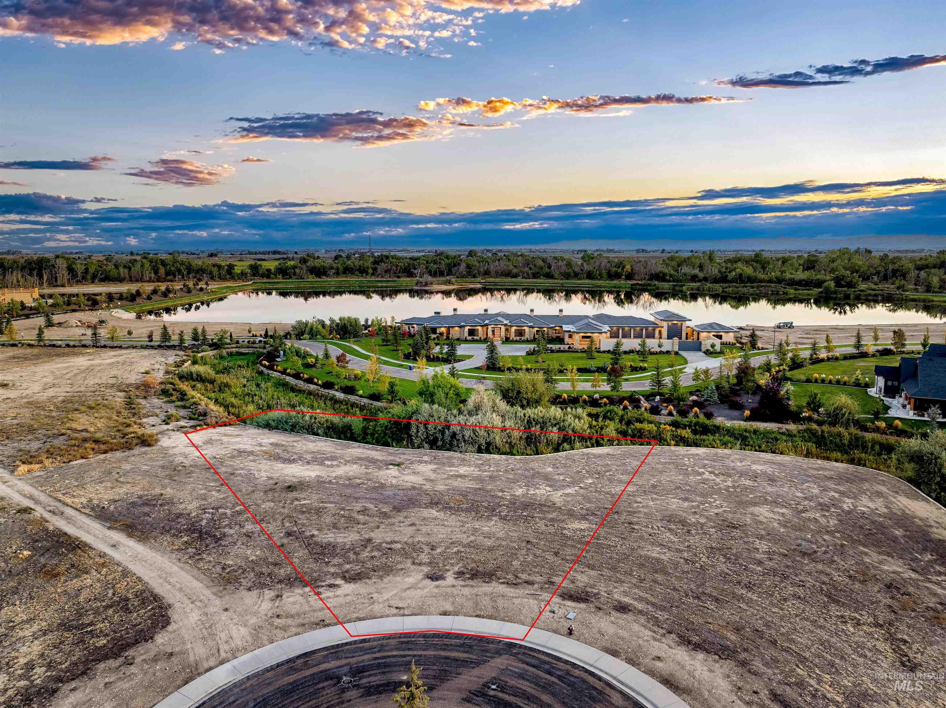 Aerial overview of property's location with property parcel outlined and a nearby body of water