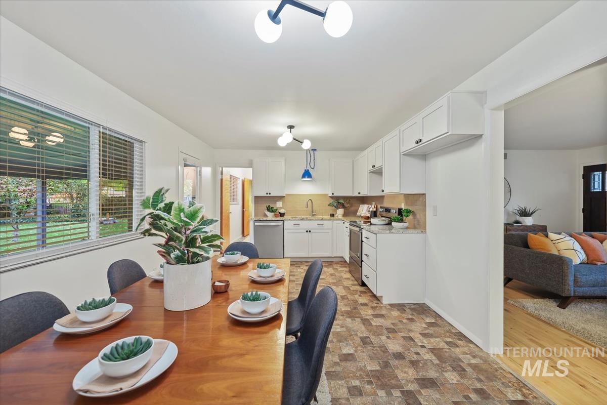 Dining space with stone finish floors
