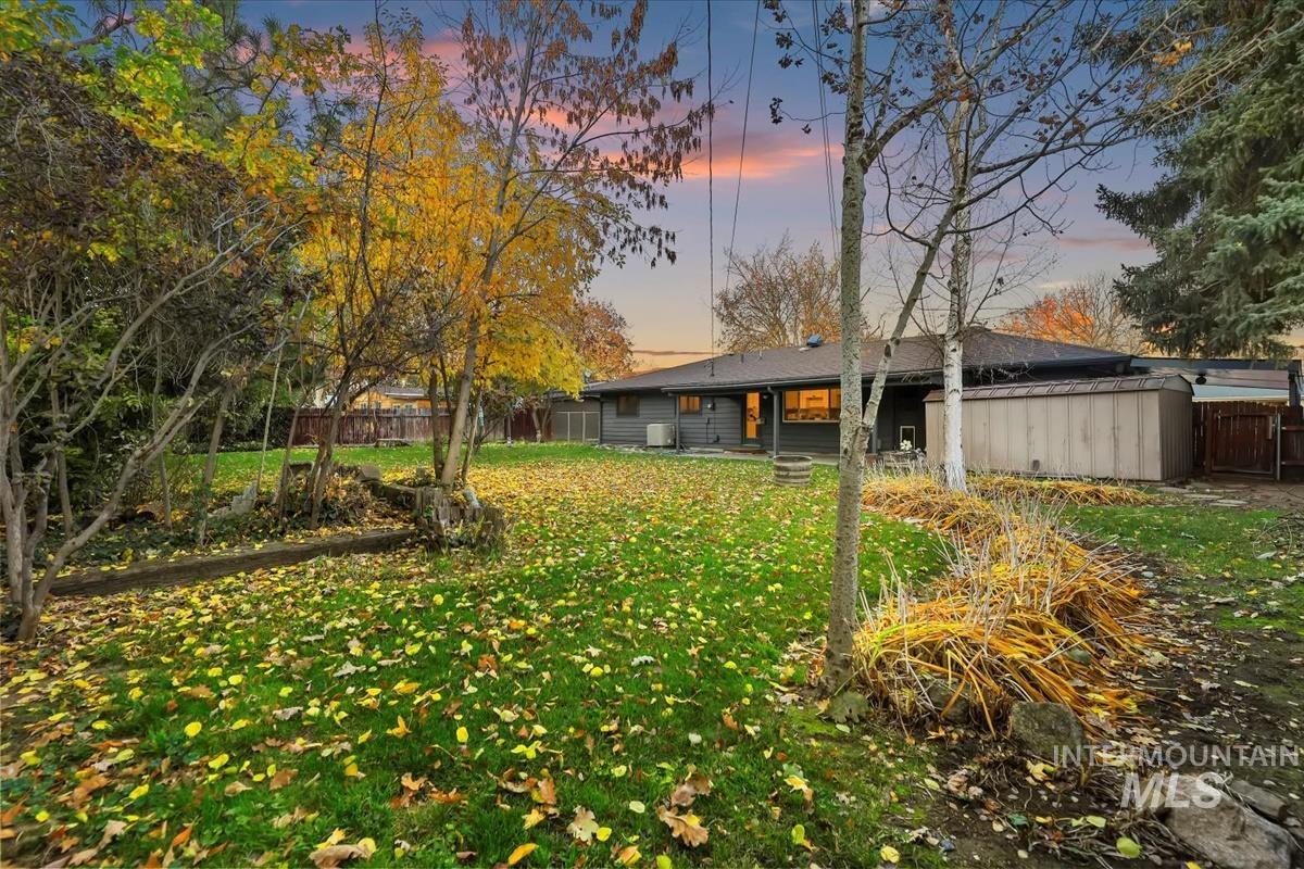 Back of house with a fenced backyard