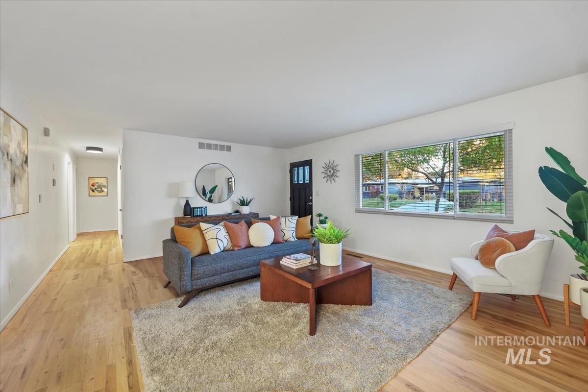 Living area featuring light wood finished floors and baseboards