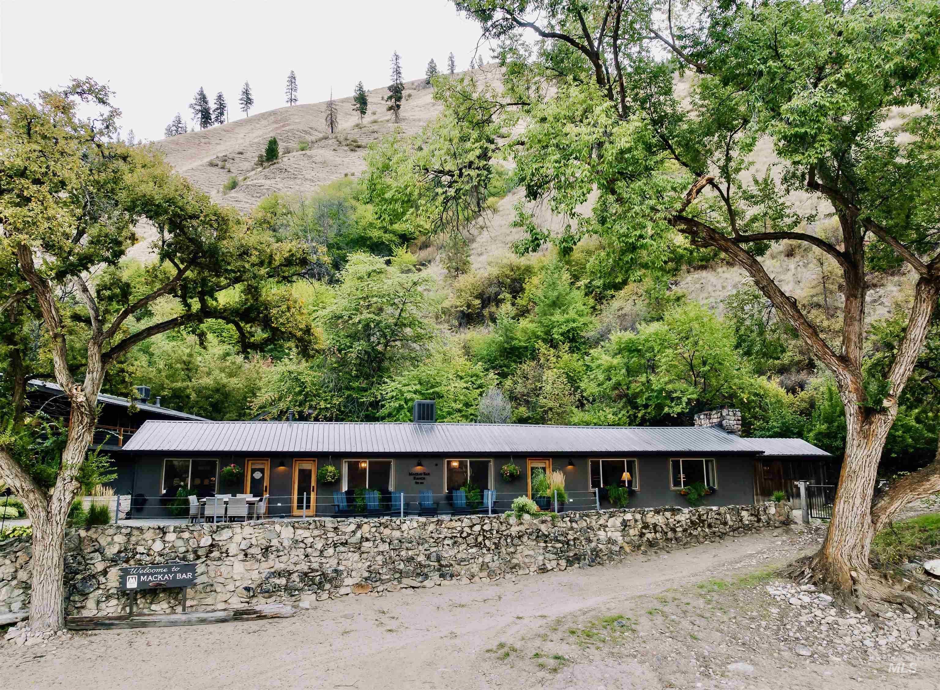 View of property's community featuring a patio and a mountain view