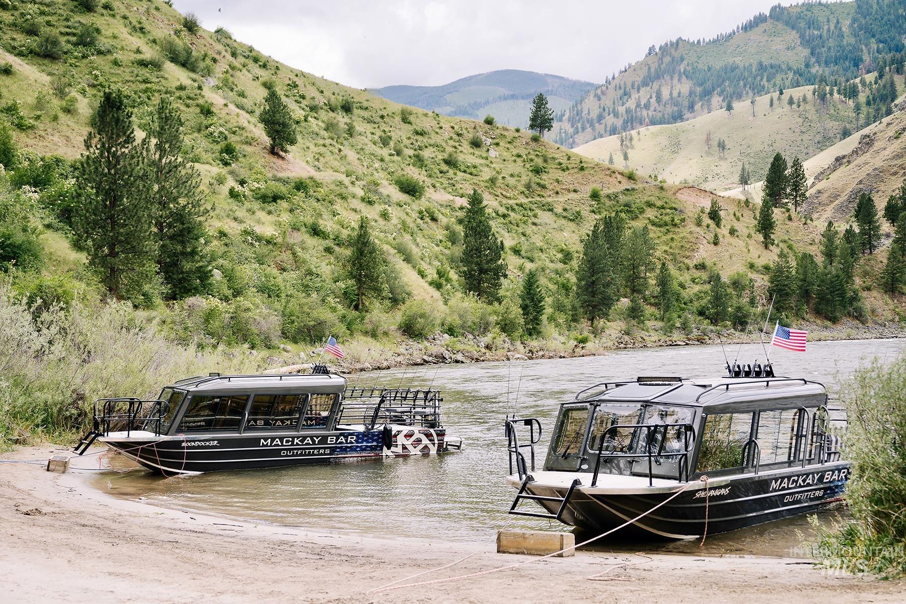 Dock area featuring a water and mountain view
