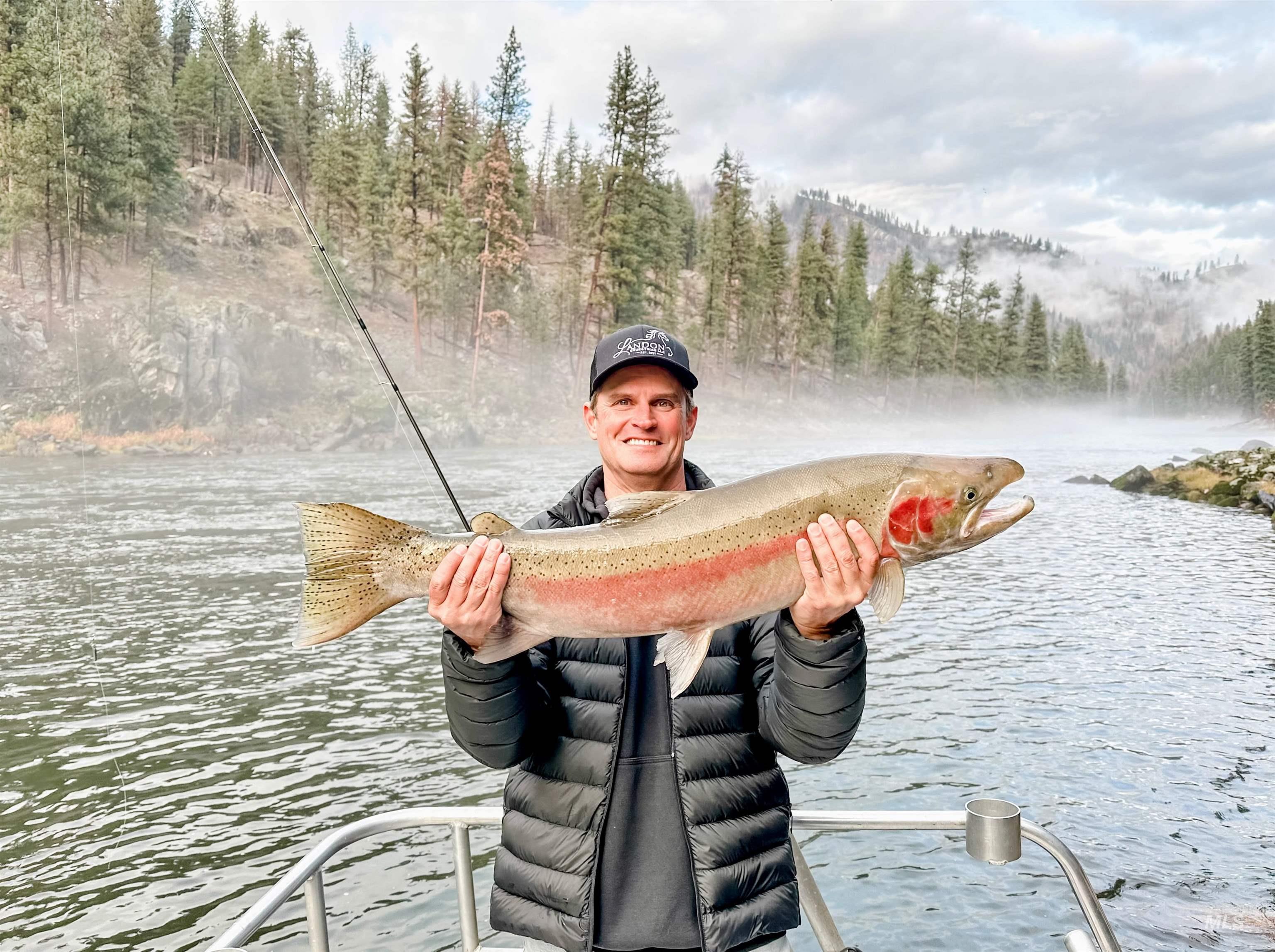 Dock featuring a view of trees and a water view