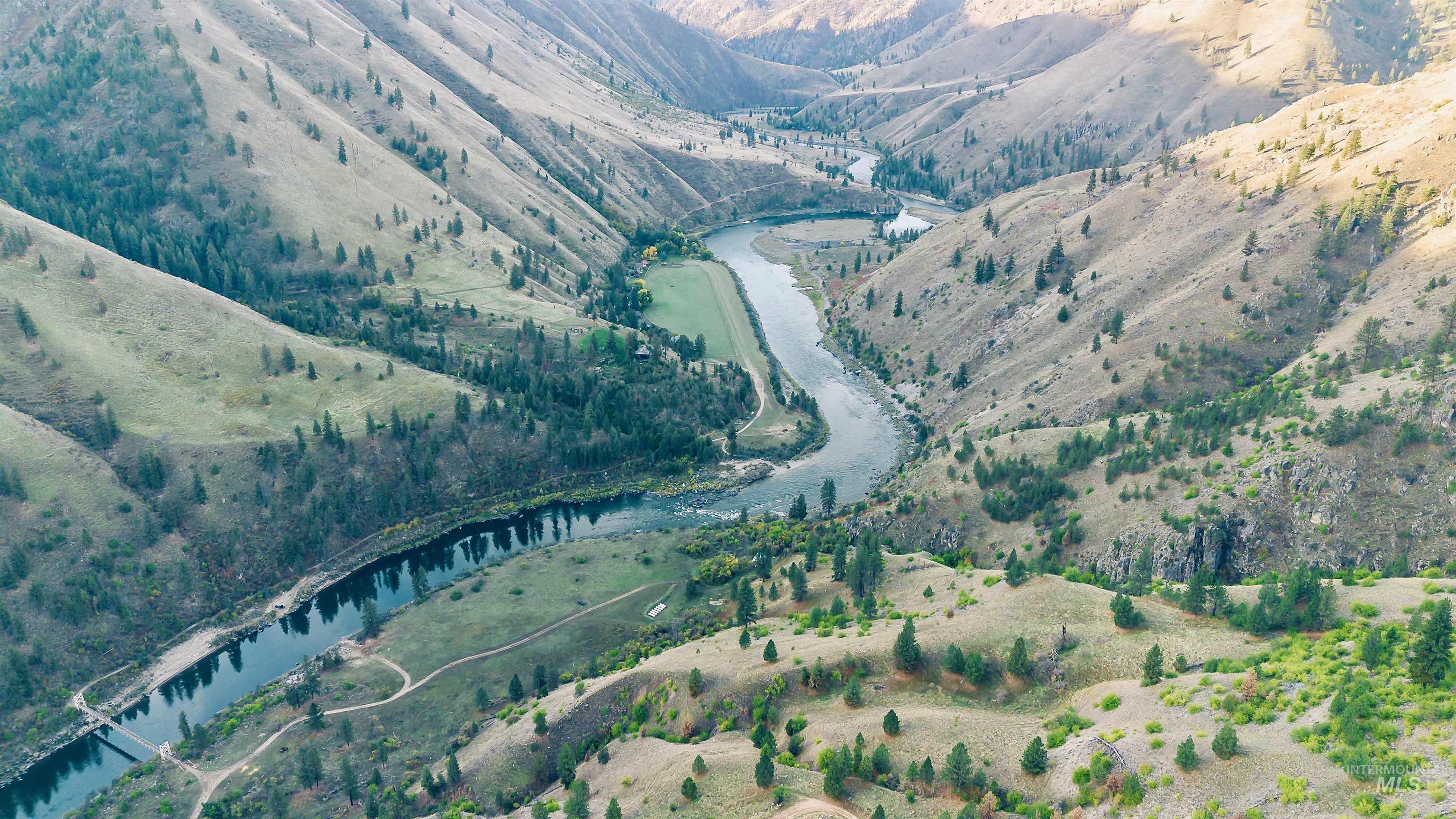 Aerial view of property's location with a nearby body of water