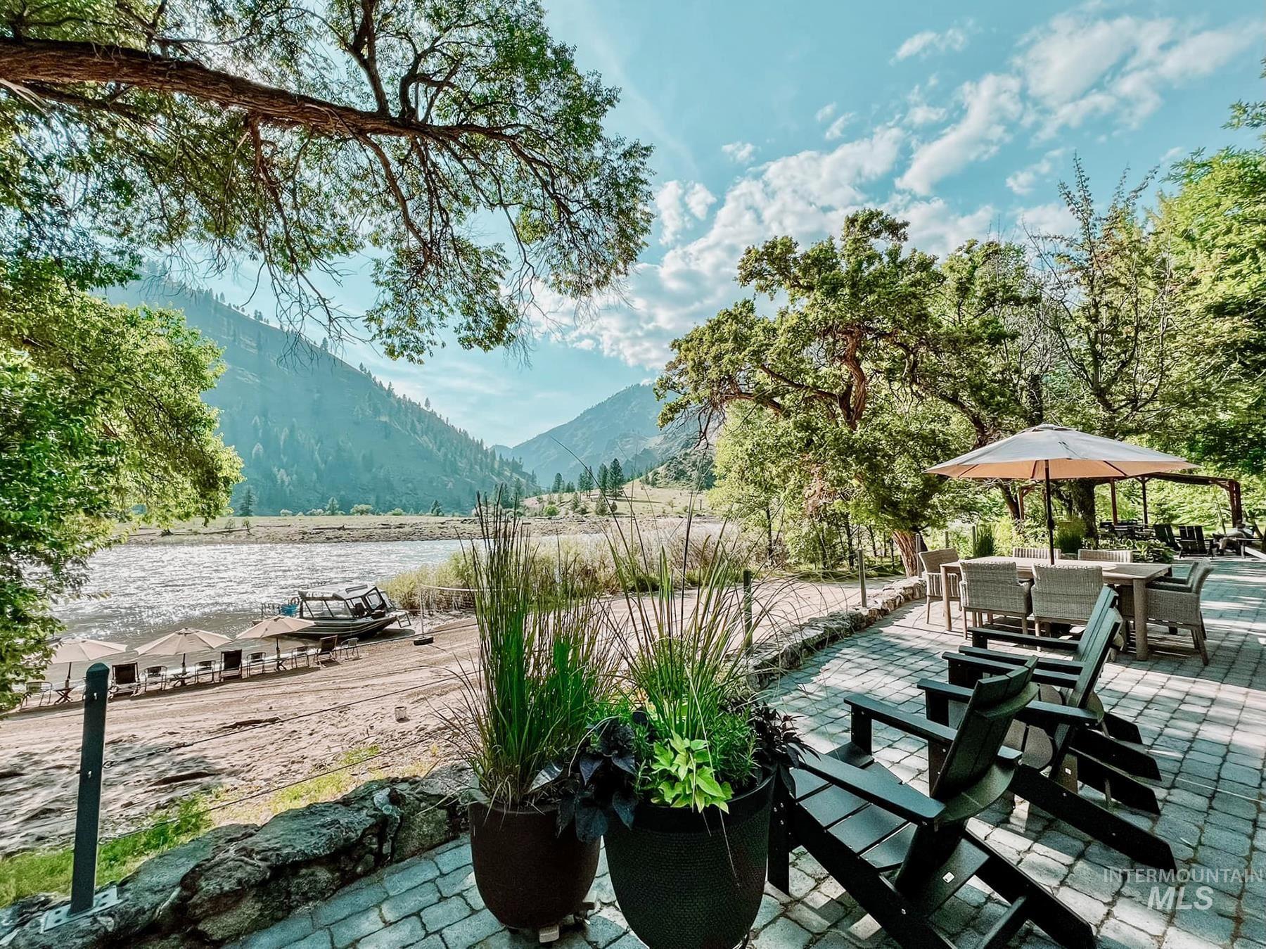 View of patio featuring a mountain view and outdoor dining area
