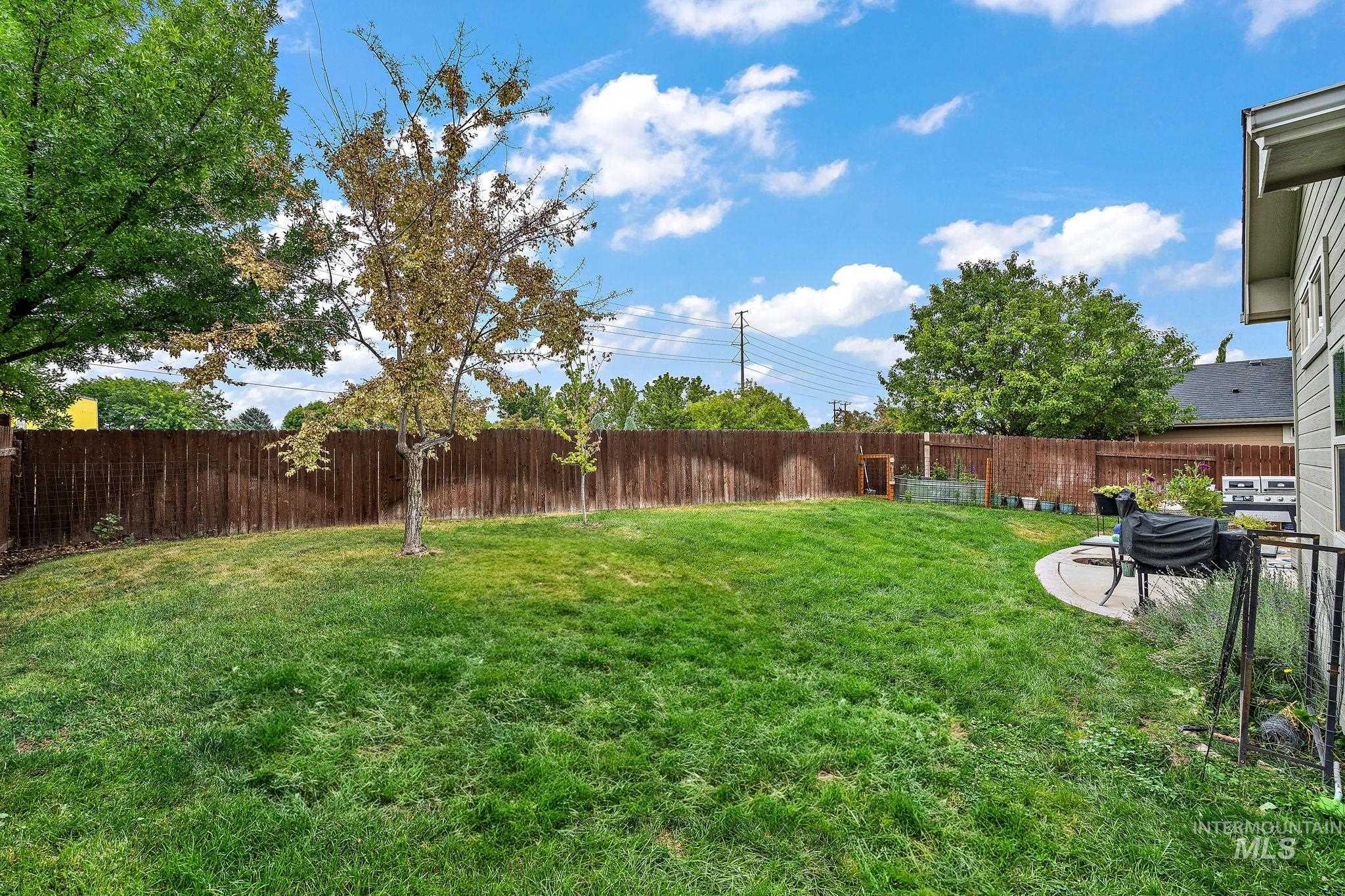 View of fenced backyard
