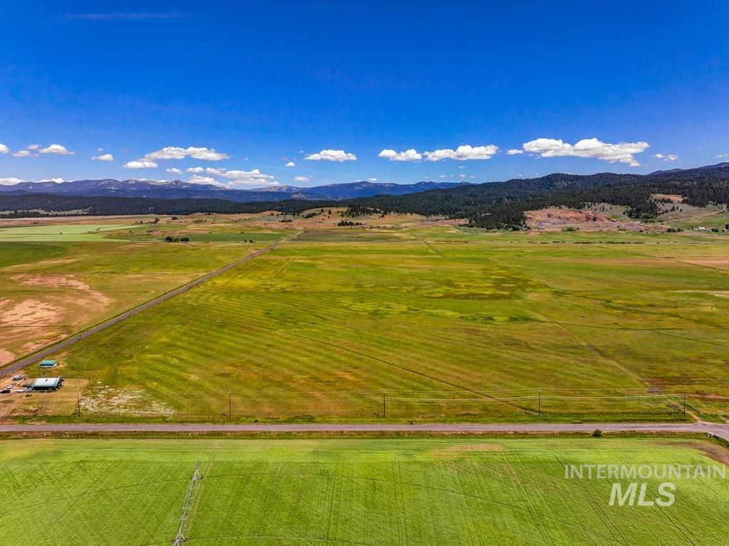 Aerial view of sparsely populated area with a mountain backdrop