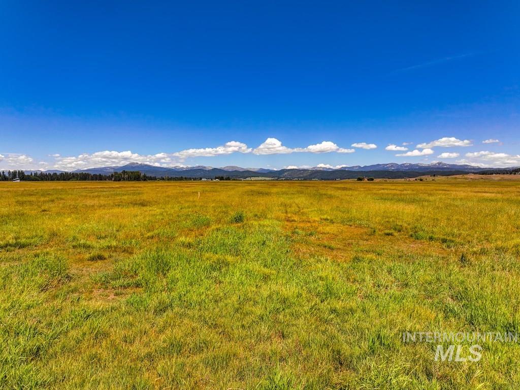 View of mountain backdrop with rural landscape