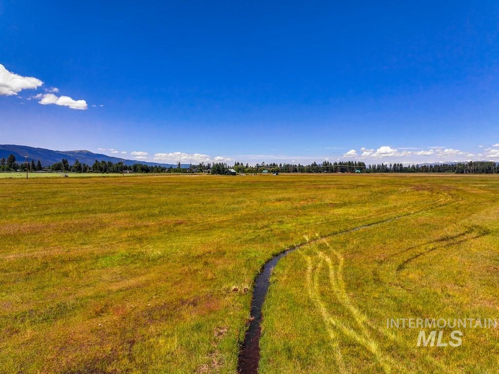 View of mountain background featuring rural landscape