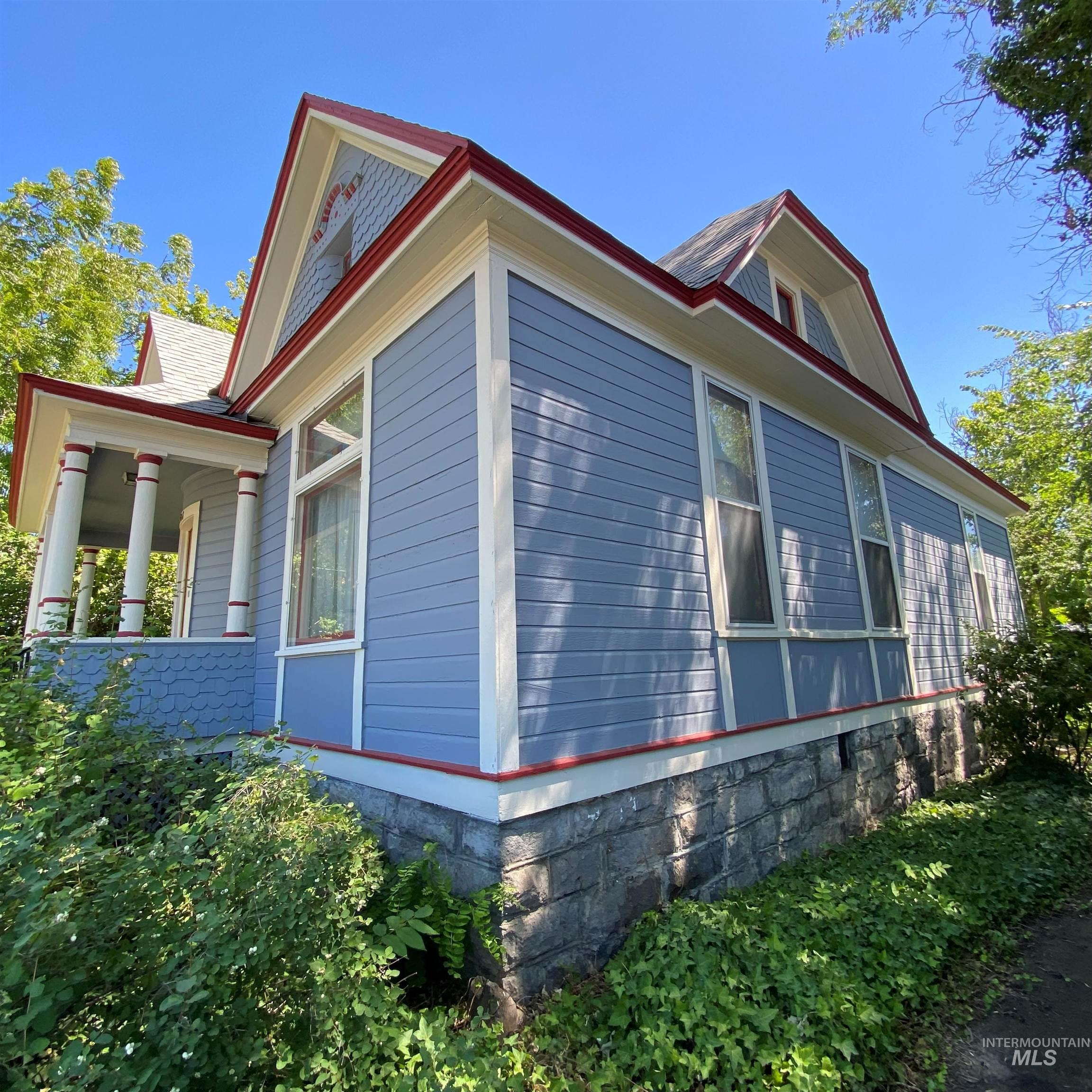 View of side of home with a porch