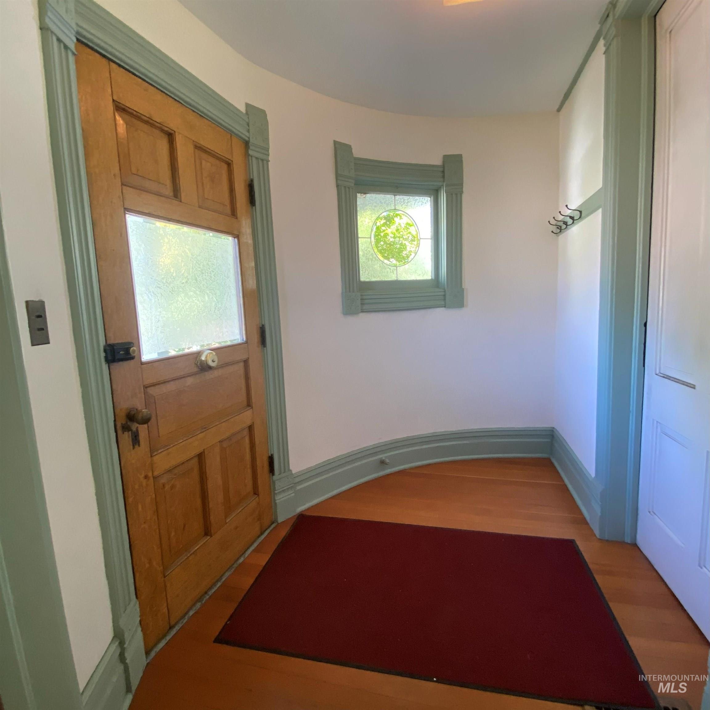 Doorway with wood finished floors
