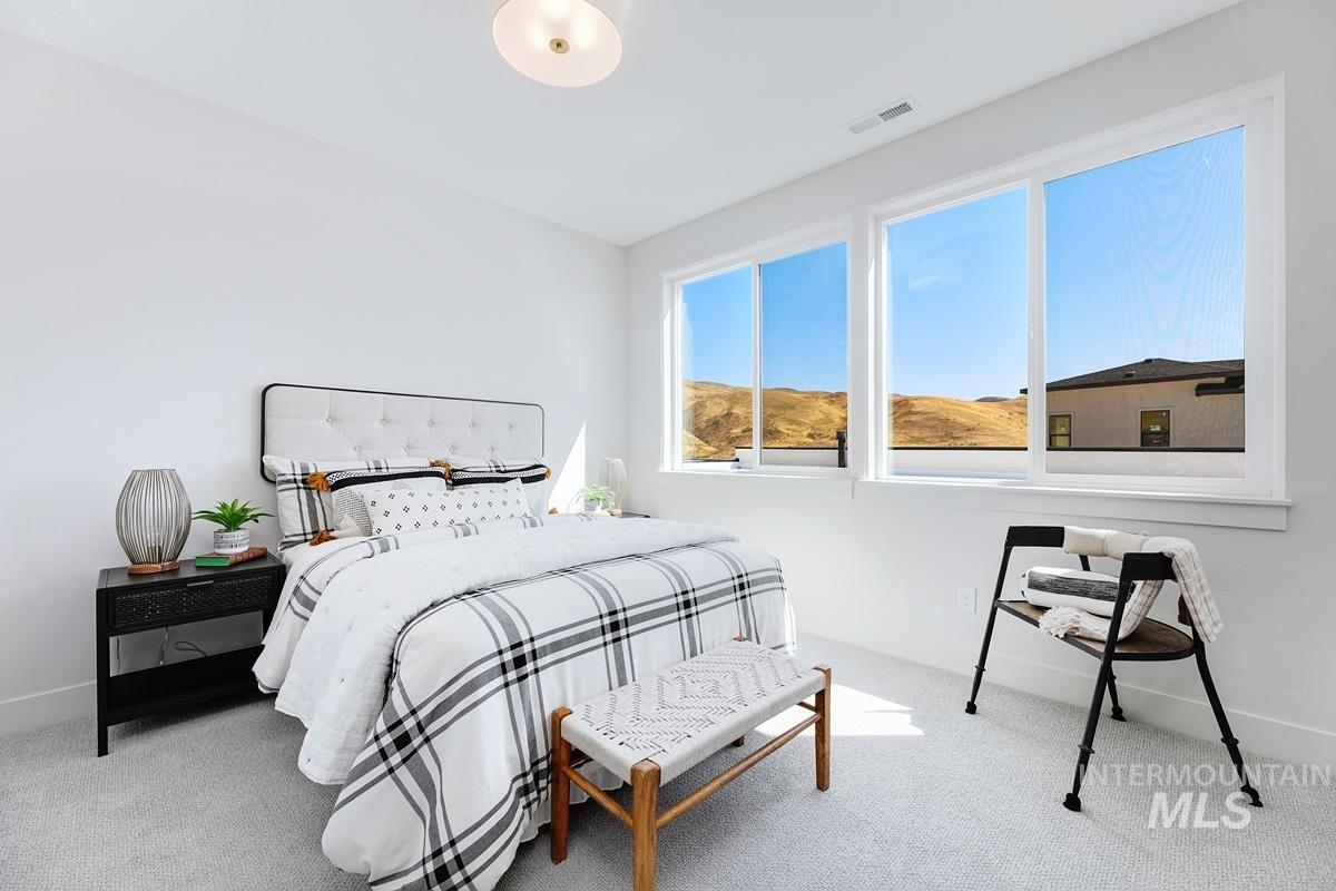Carpeted bedroom with baseboards