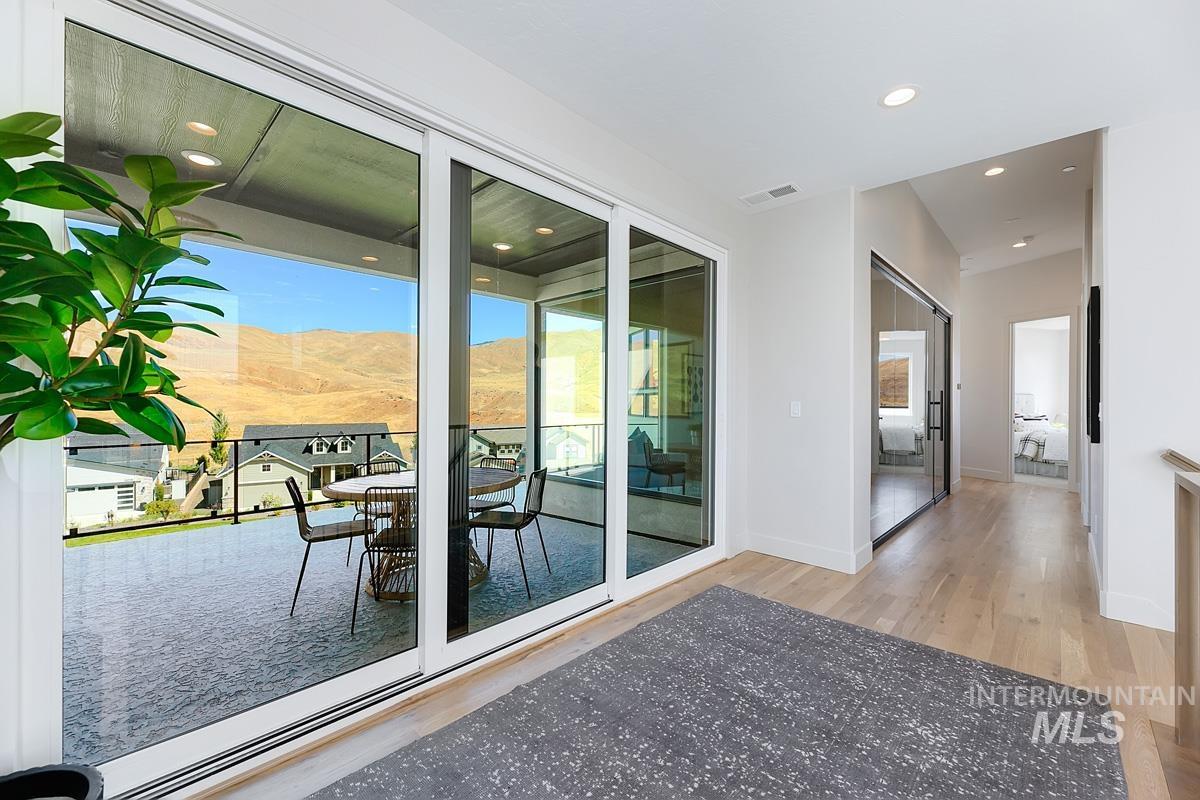 Doorway featuring recessed lighting, wood finished floors, and a mountain view