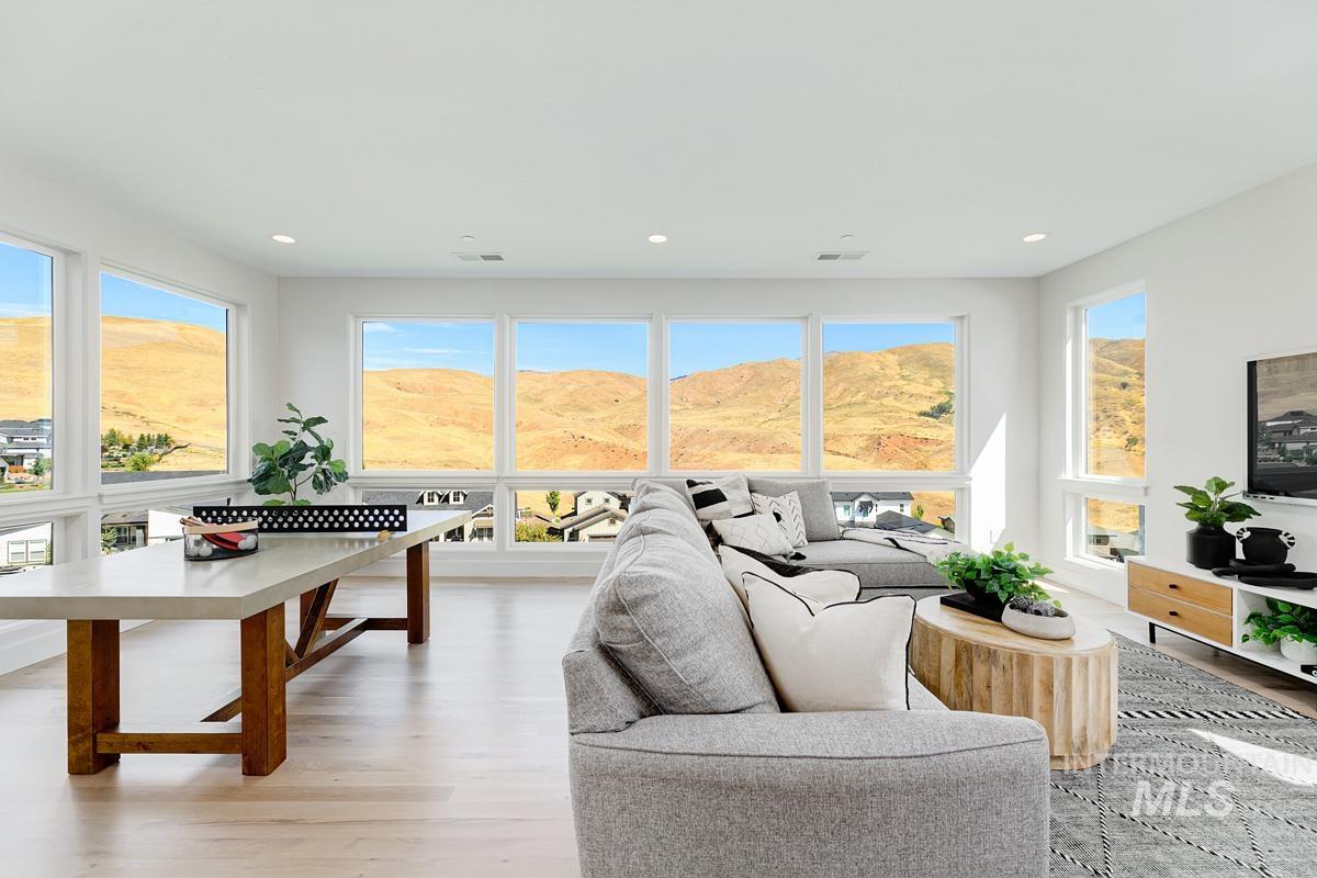 Living room featuring light wood-style floors and recessed lighting