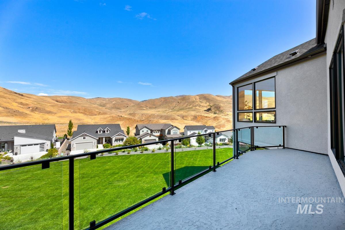 Balcony featuring a mountain view and a residential view
