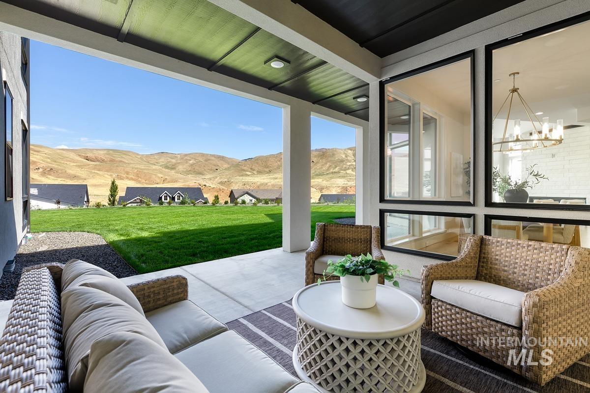 View of patio / terrace featuring a mountain view and an outdoor hangout area