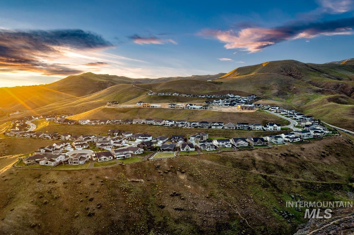 Aerial perspective of suburban area featuring a mountain backdrop