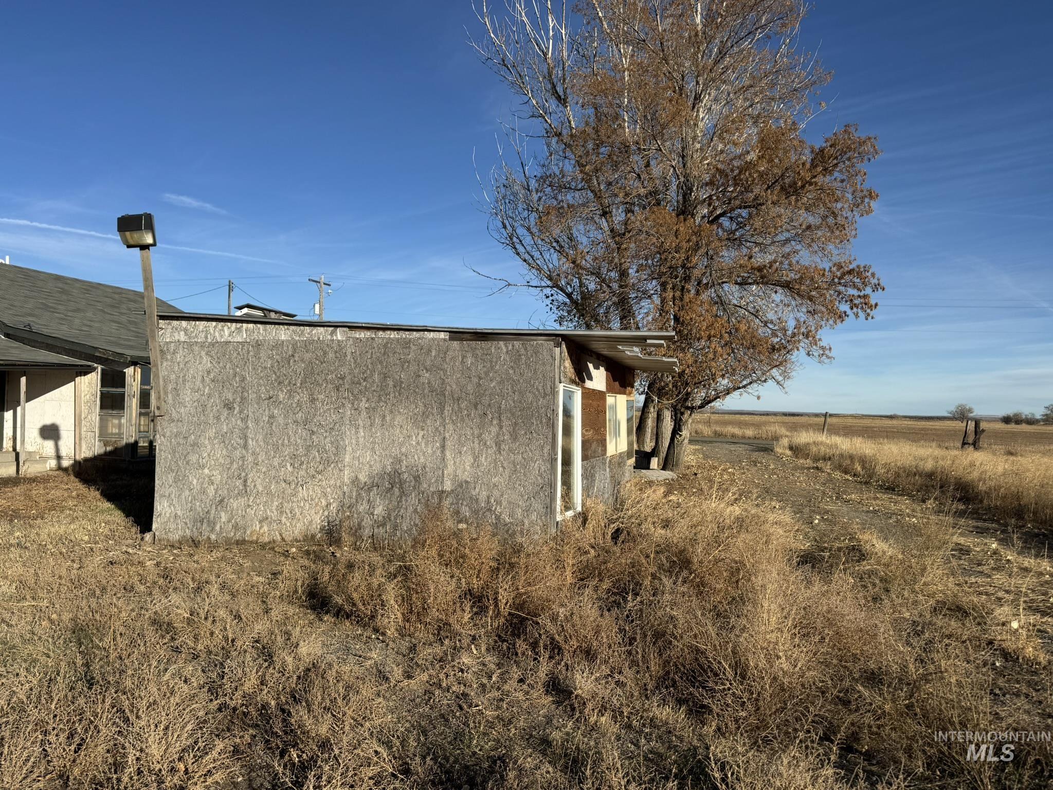 View of side of home with stucco siding
