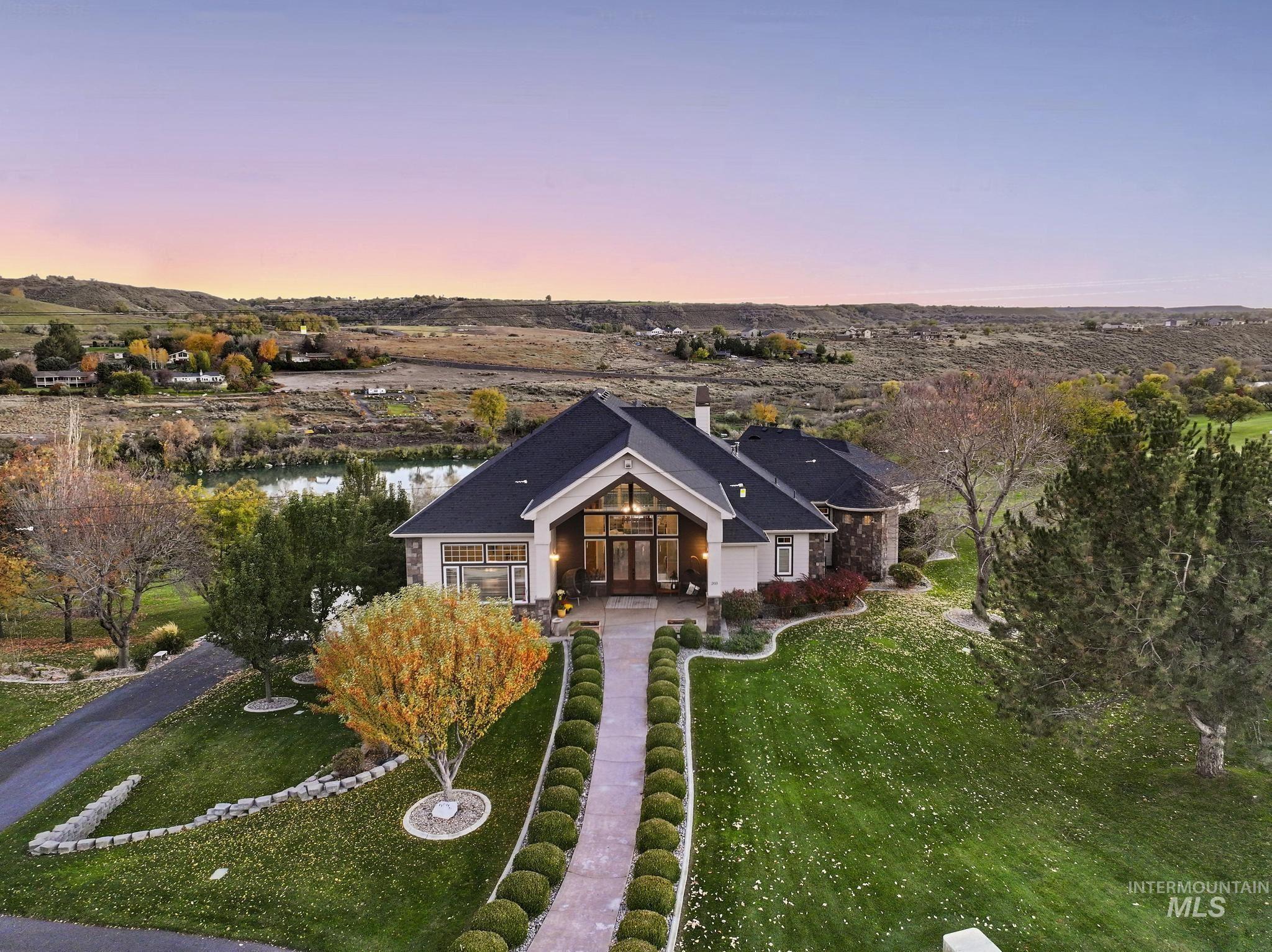View of front of home featuring a front yard and a chimney