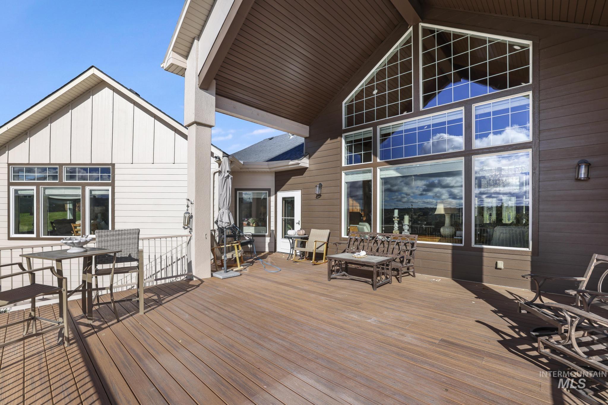 Wooden deck featuring outdoor dining area