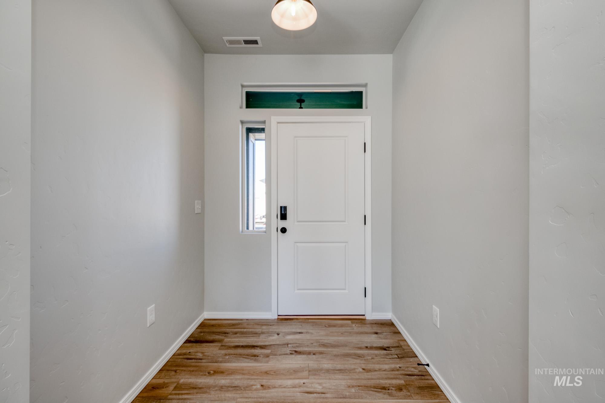 Entryway with light wood-type flooring