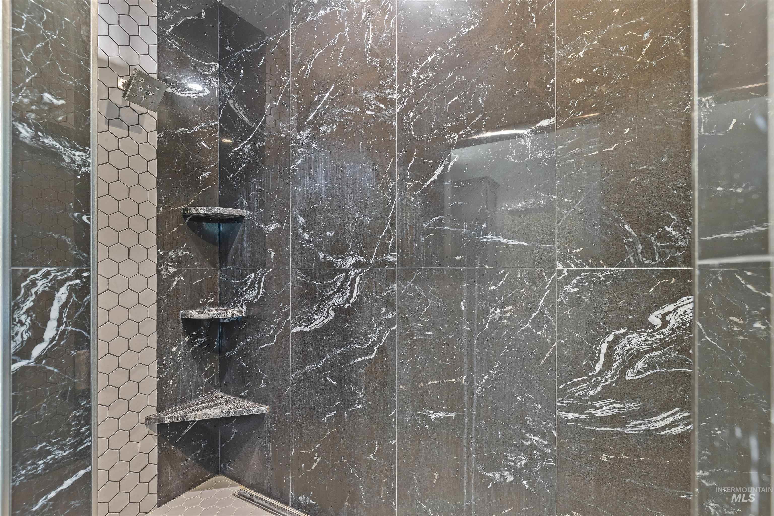 Full bathroom with tiled shower